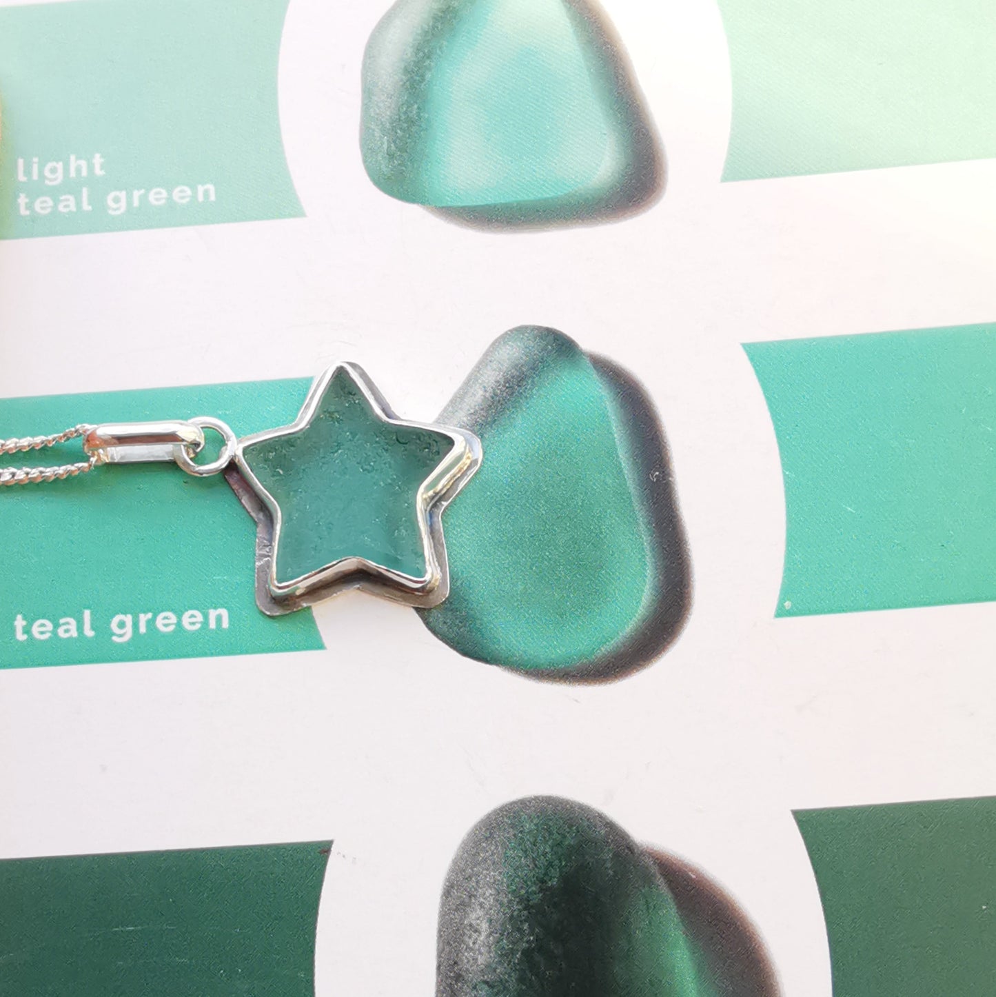 Scottish teal sea glass star & sterling silver pendant.