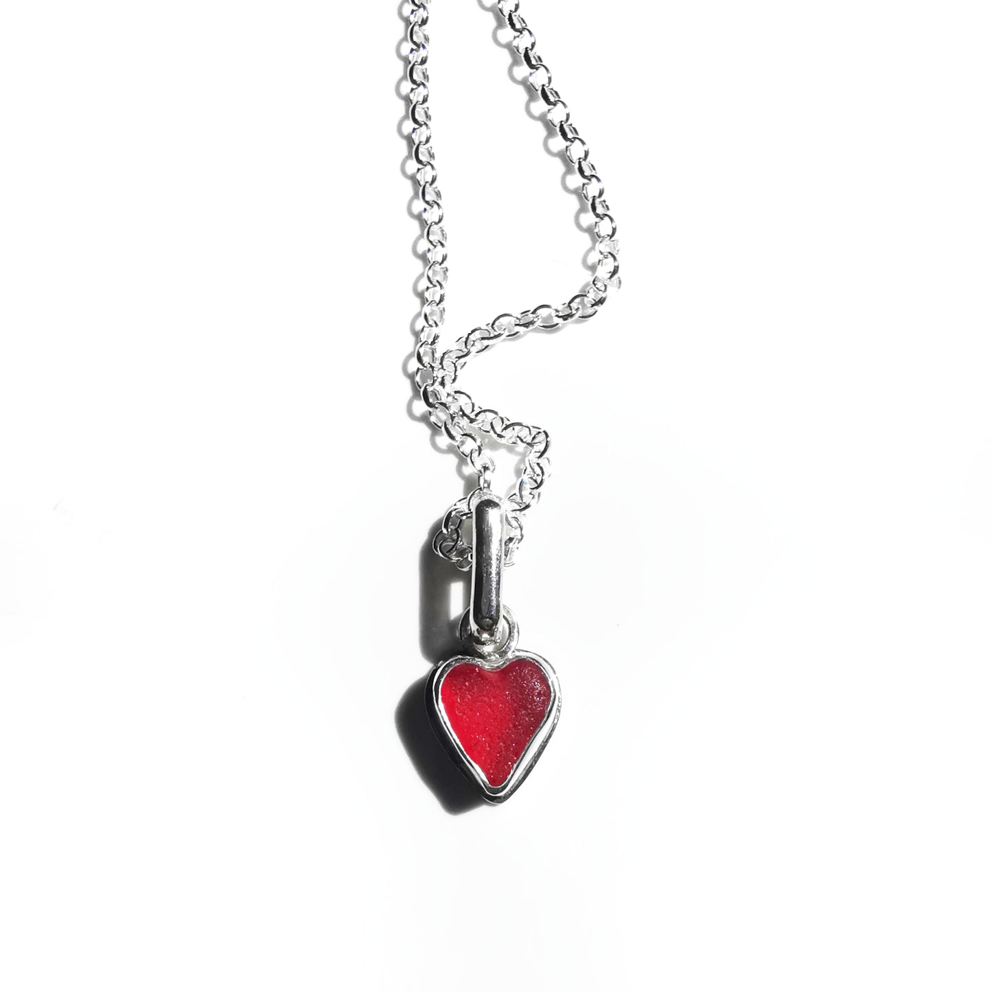Tiny Scottish UV red sea glass heart & sterling silver pendant.