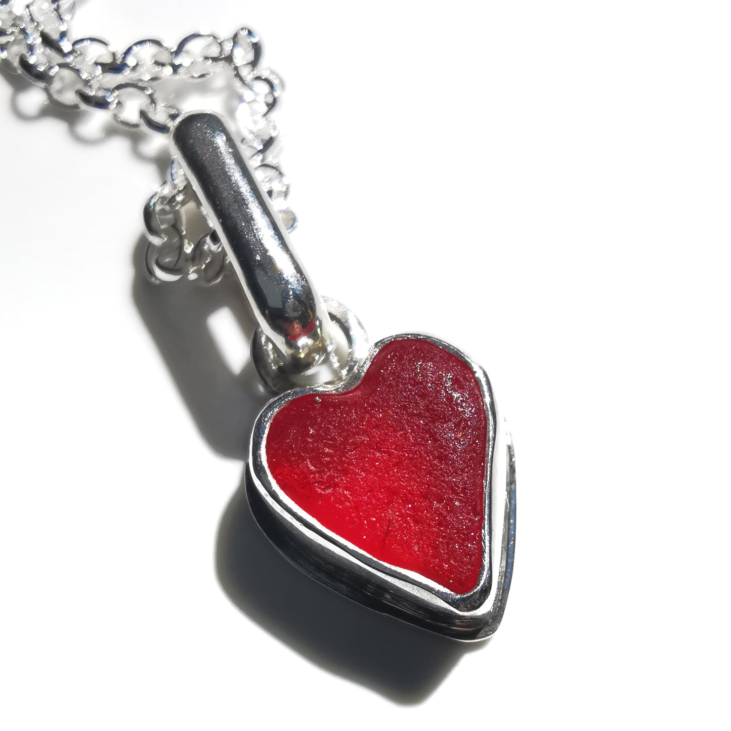 Tiny Scottish UV red sea glass heart & sterling silver pendant.