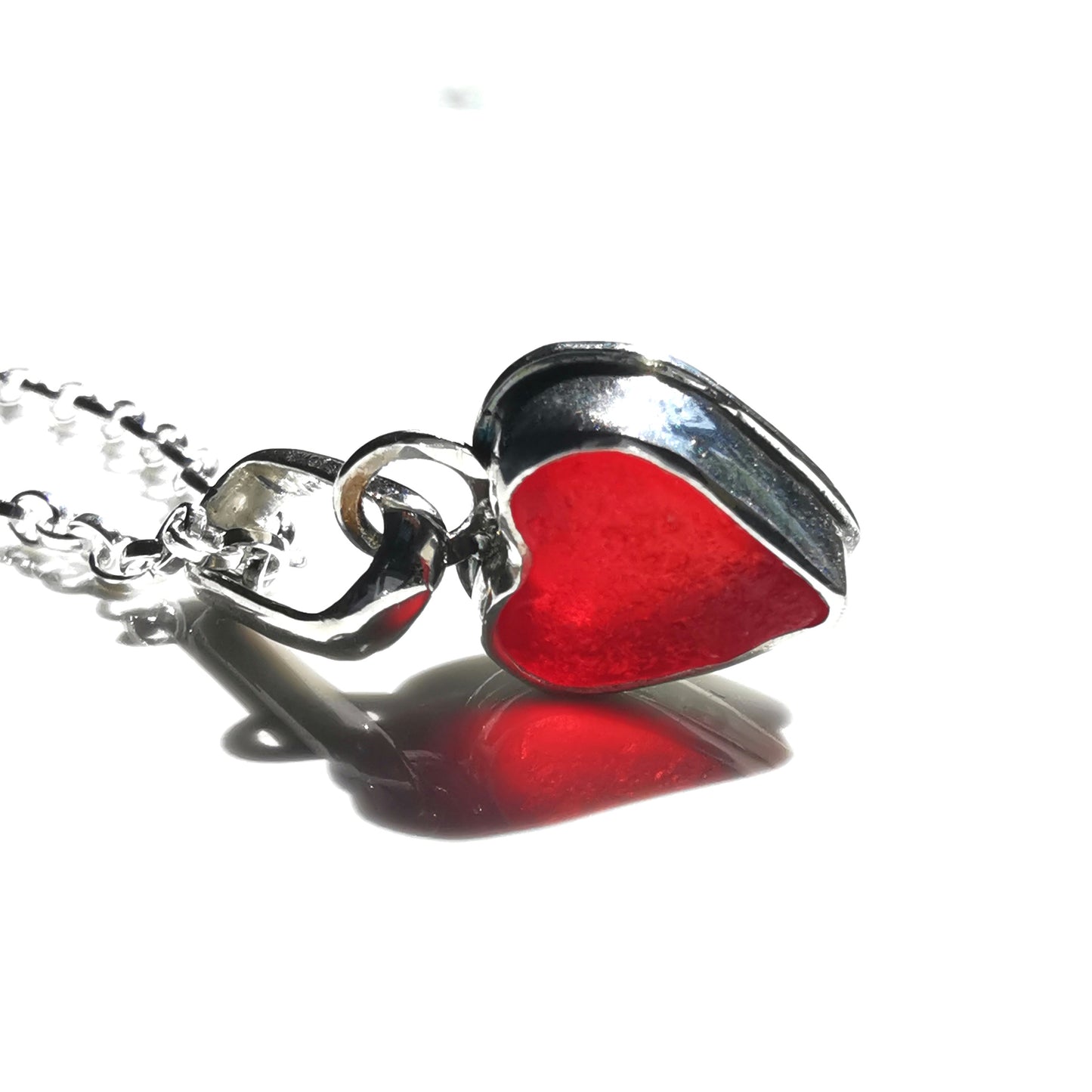 Tiny Scottish UV red sea glass heart & sterling silver pendant.