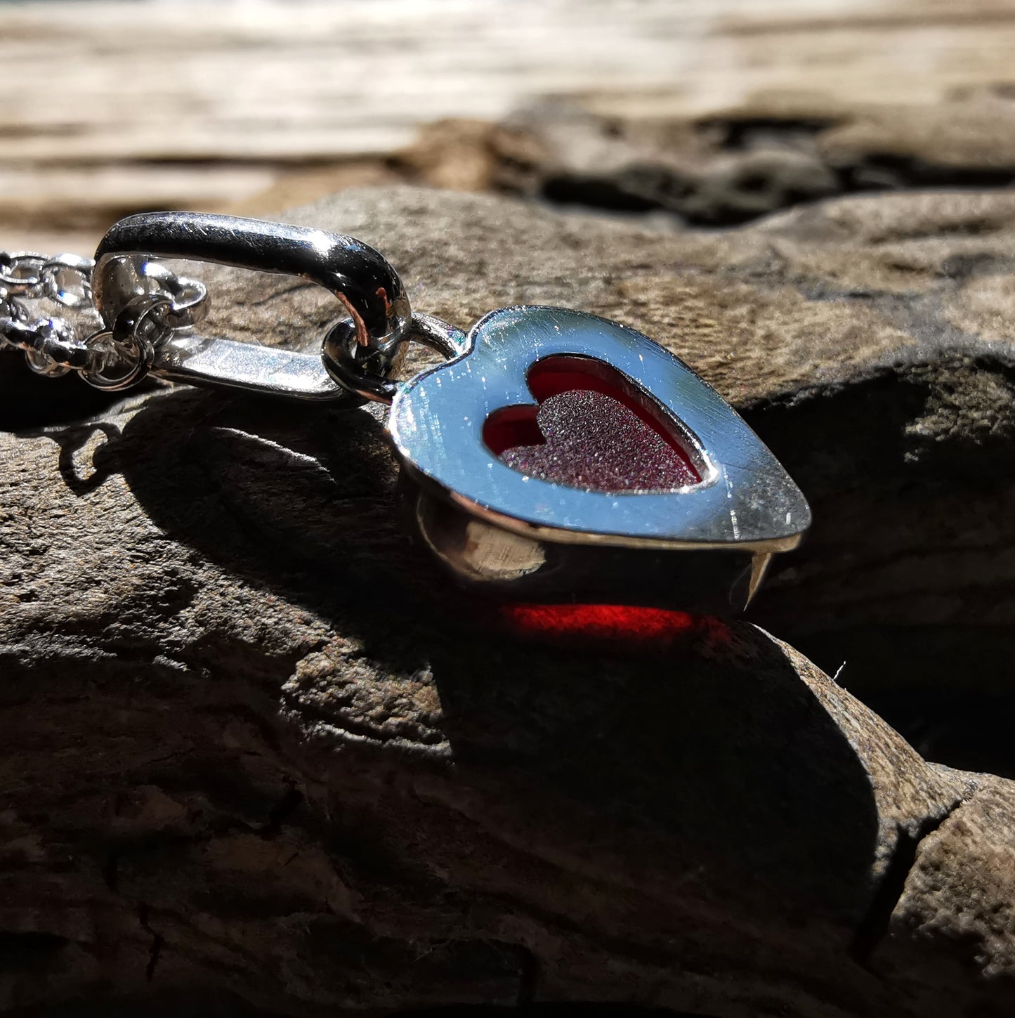 Tiny Scottish UV red sea glass heart & sterling silver pendant.