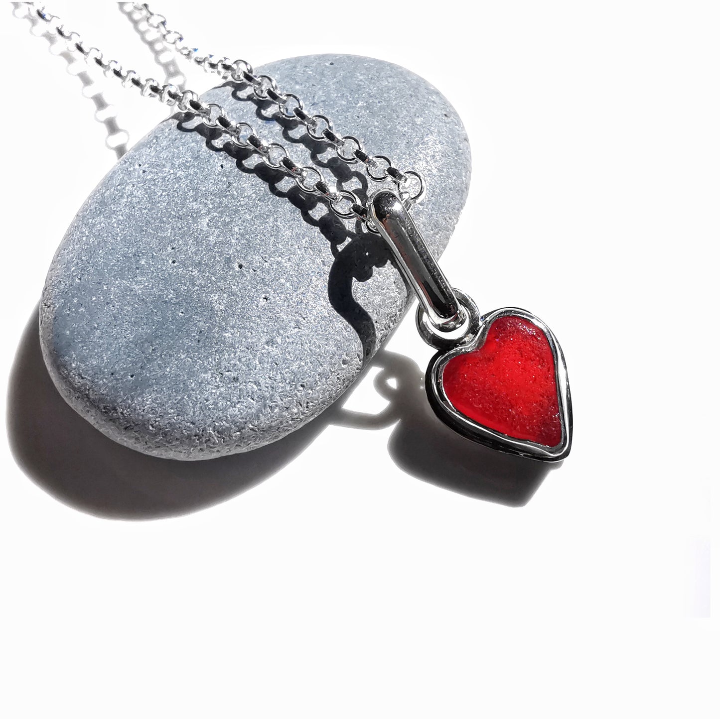Tiny Scottish UV red sea glass heart & sterling silver pendant.