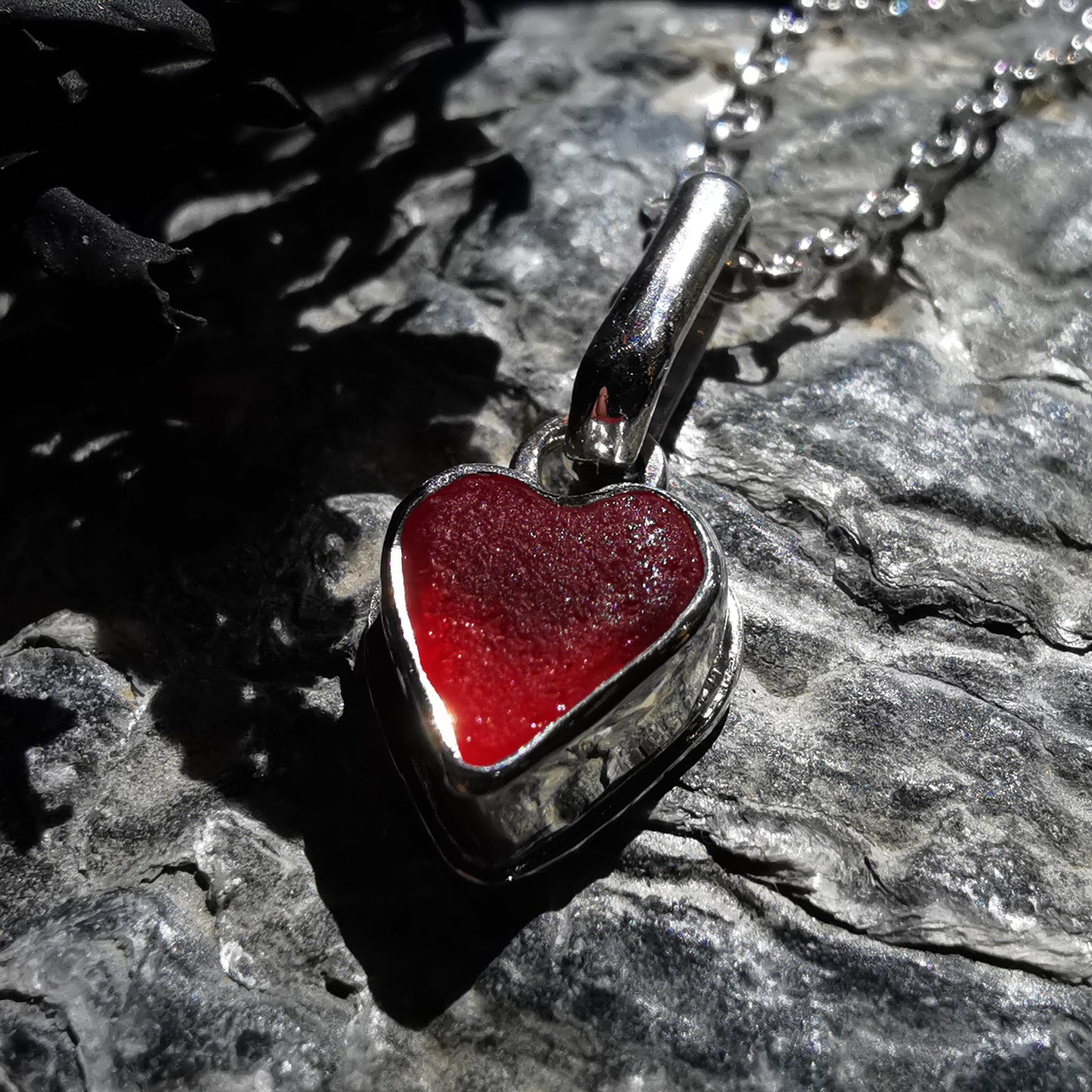 Tiny Scottish UV red sea glass heart & sterling silver pendant.