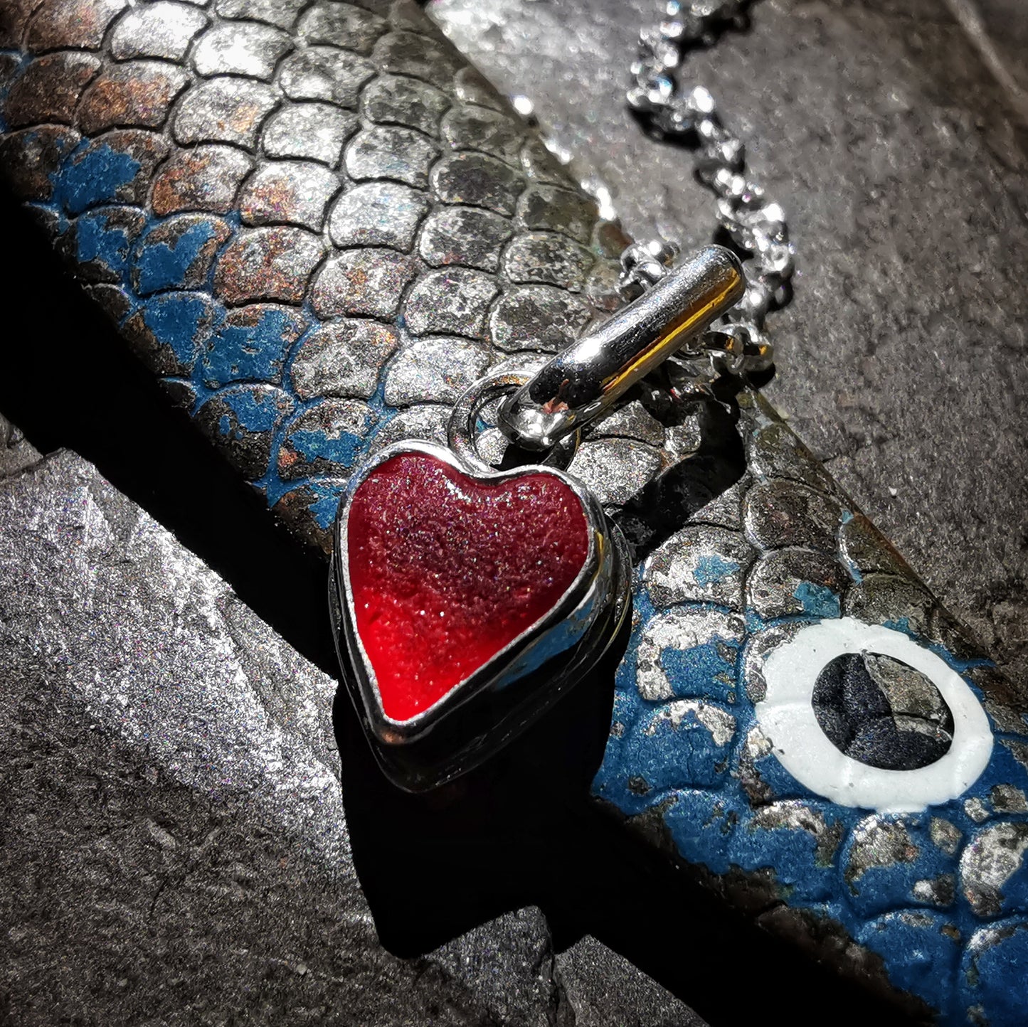 Tiny Scottish UV red sea glass heart & sterling silver pendant.