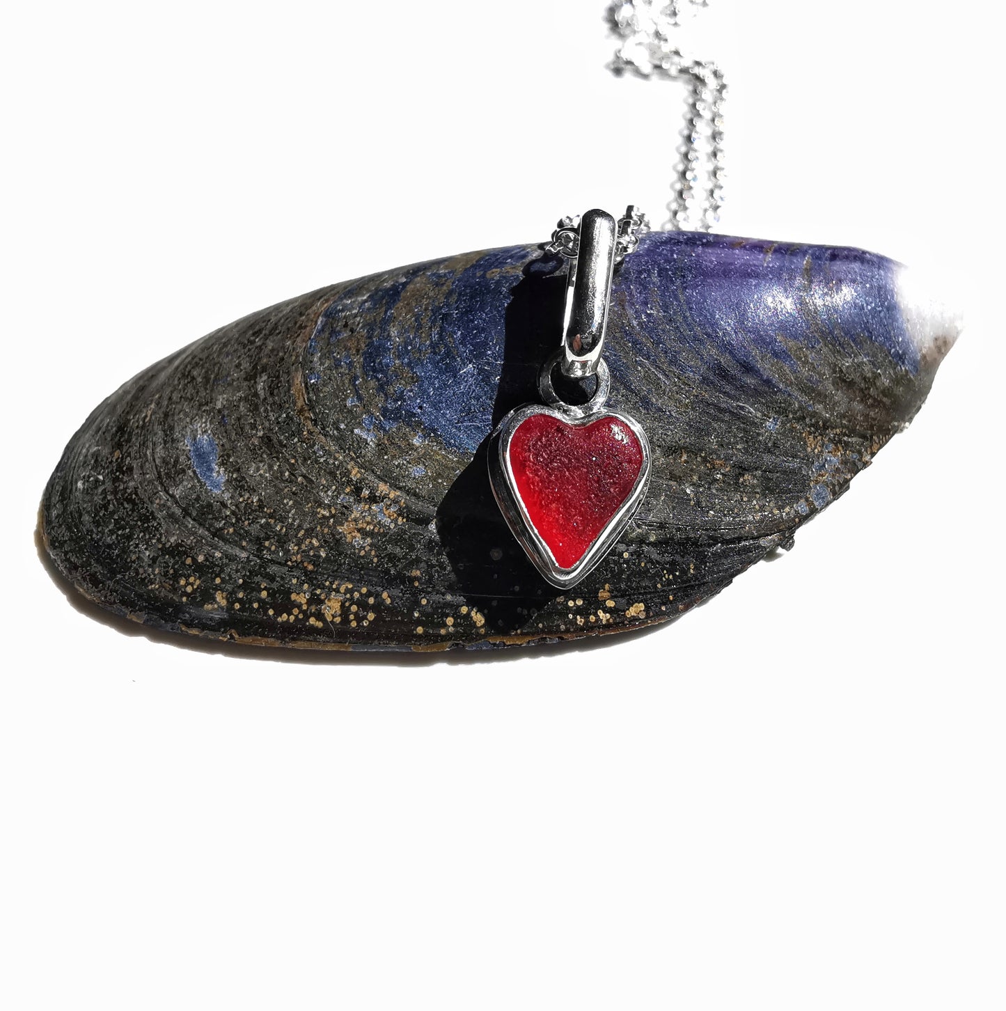 Tiny Scottish UV red sea glass heart & sterling silver pendant.