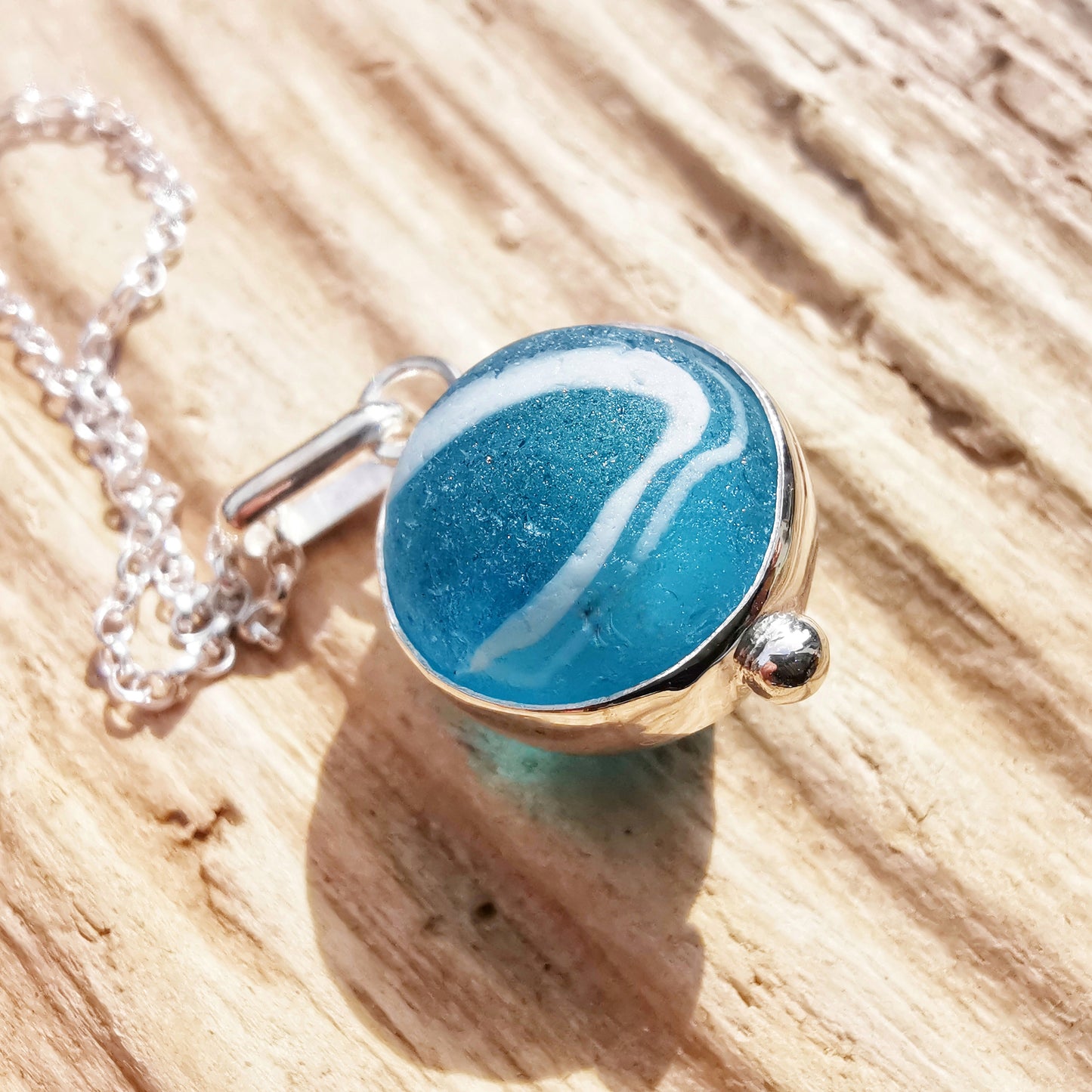 Aqua blue sea glass marble & sterling silver pendant.