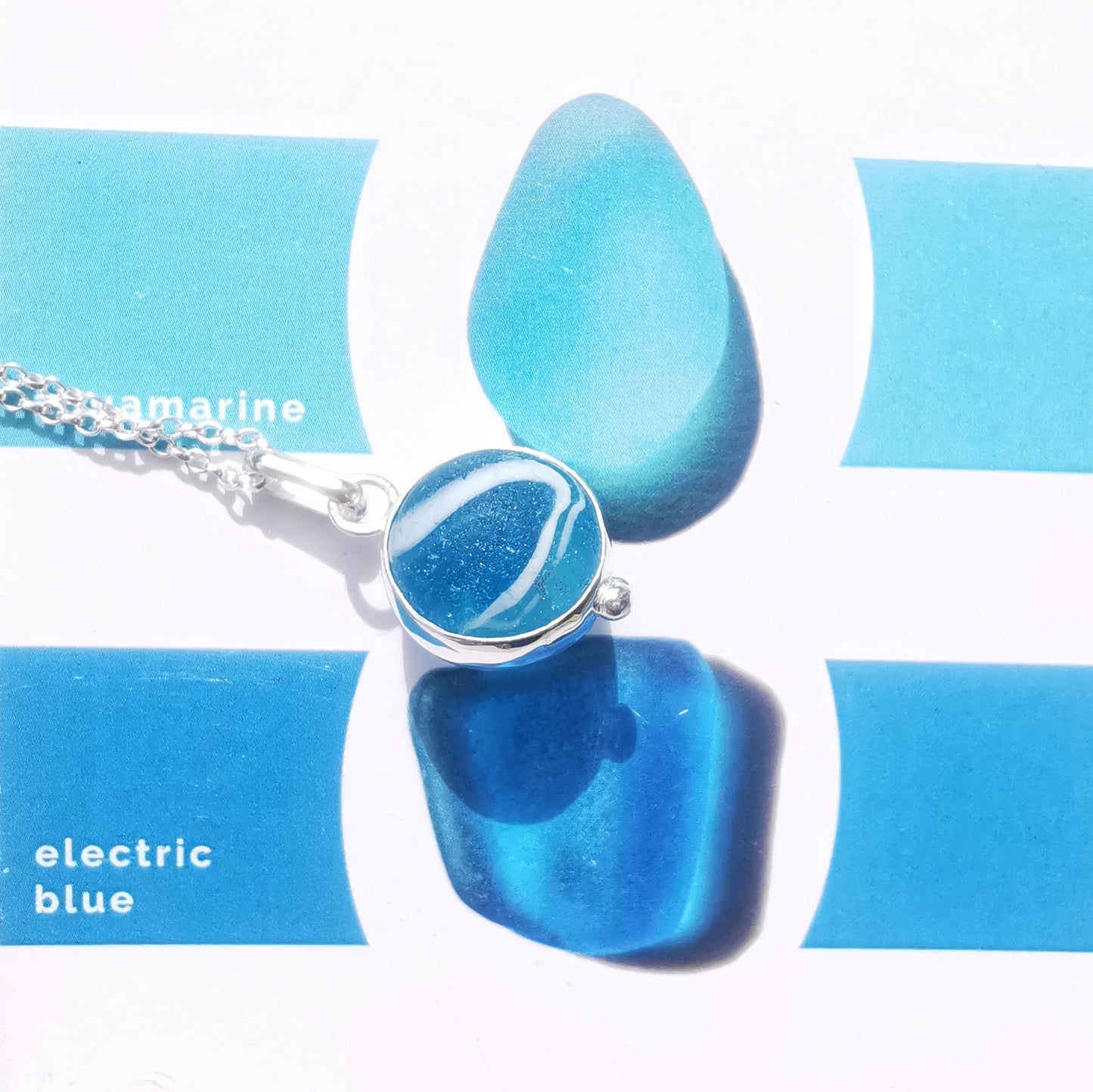 Aqua blue sea glass marble & sterling silver pendant.