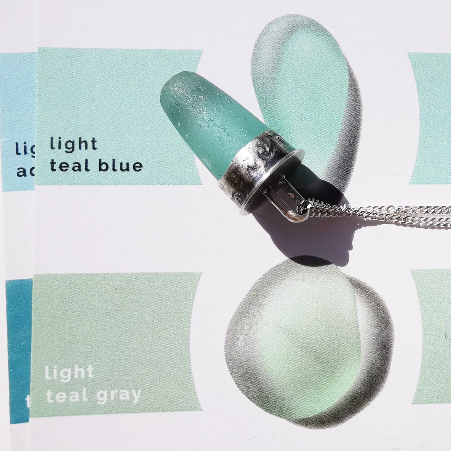 Scottish teal sea glass stopper stem & sterling silver pendant.