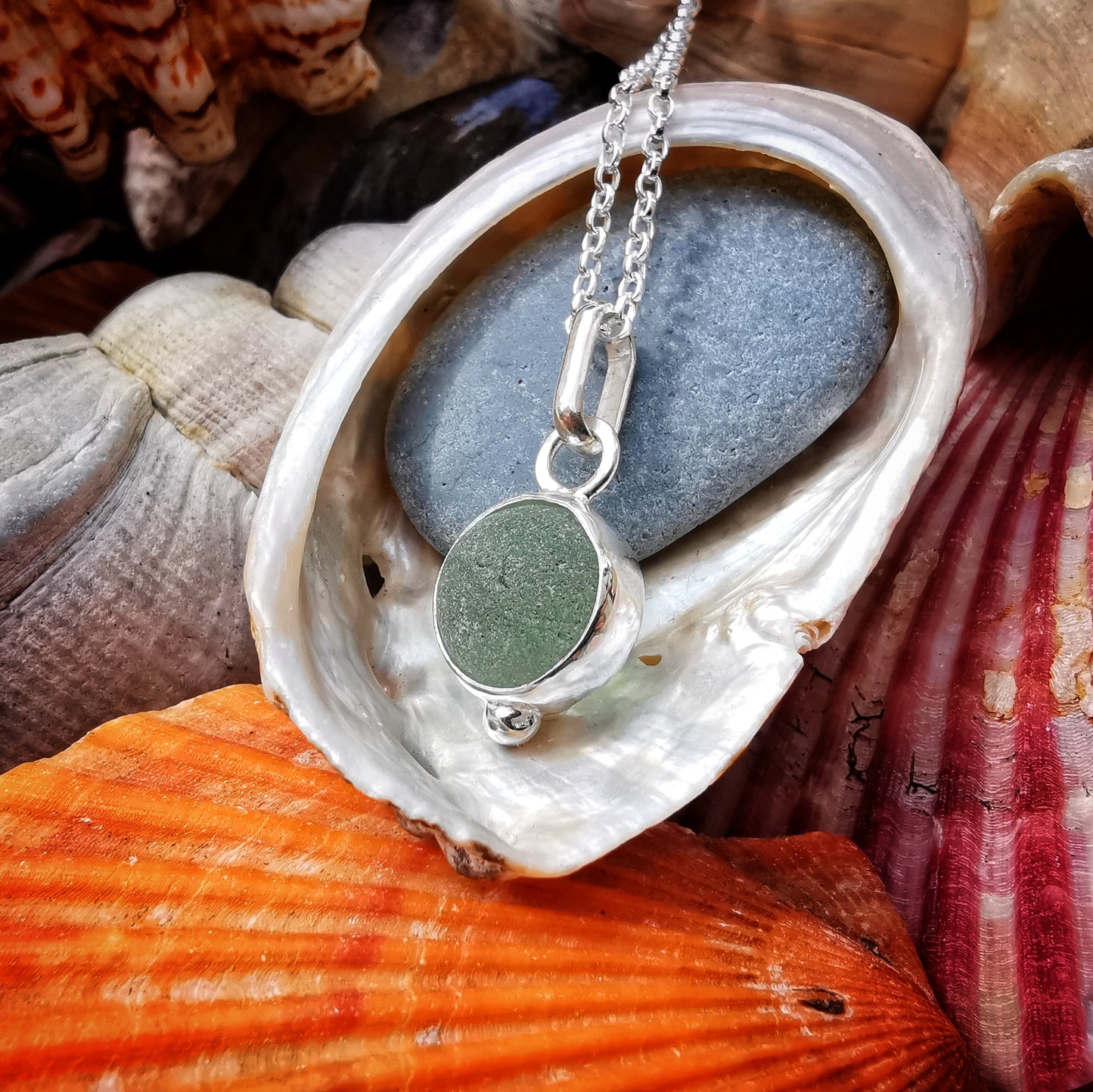 Genuine tiny Scottish Codd sea glass marble & sterling silver pendant.