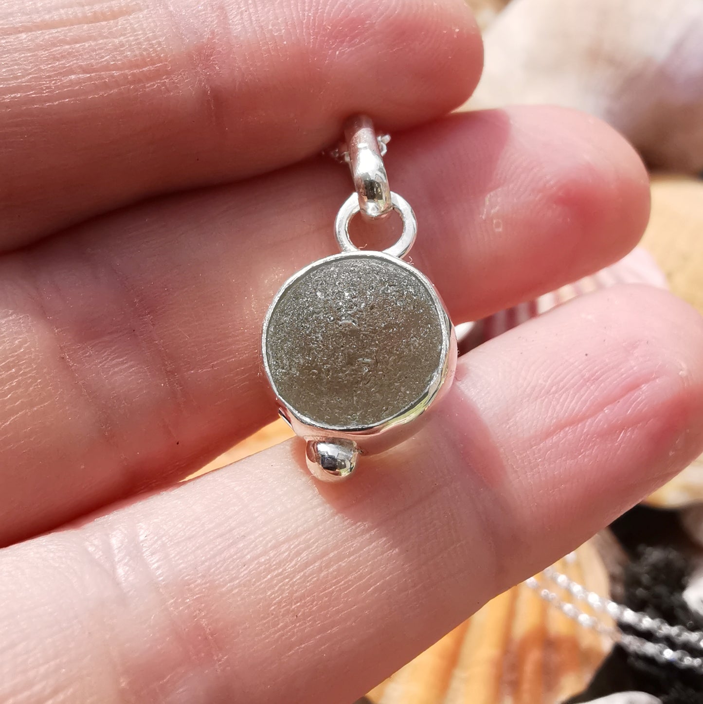 Genuine tiny Scottish Codd sea glass marble & sterling silver pendant.