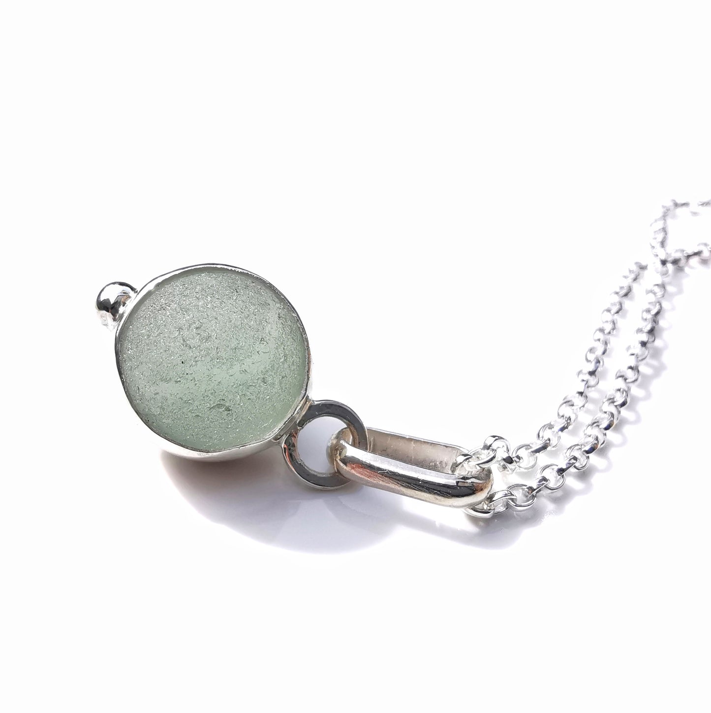 Genuine tiny Scottish Codd sea glass marble & sterling silver pendant.