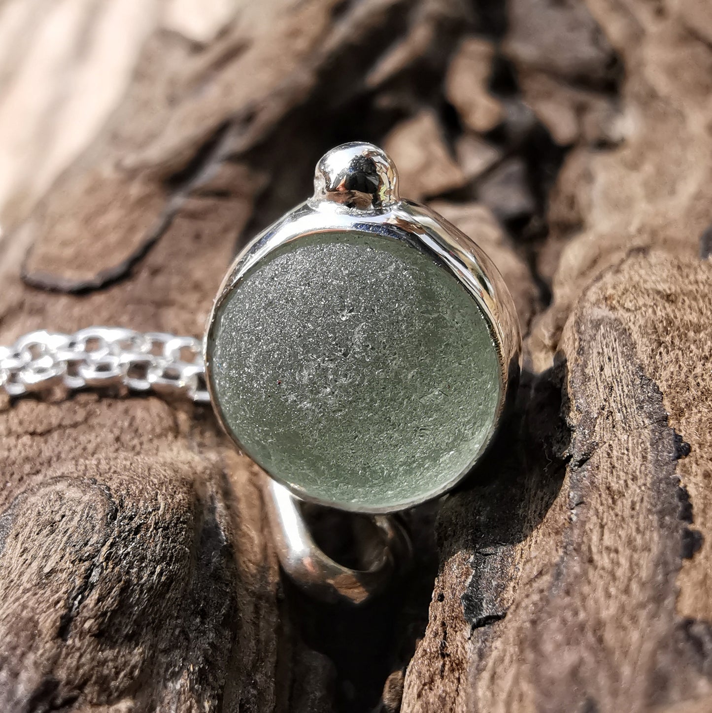 Genuine tiny Scottish Codd sea glass marble & sterling silver pendant.