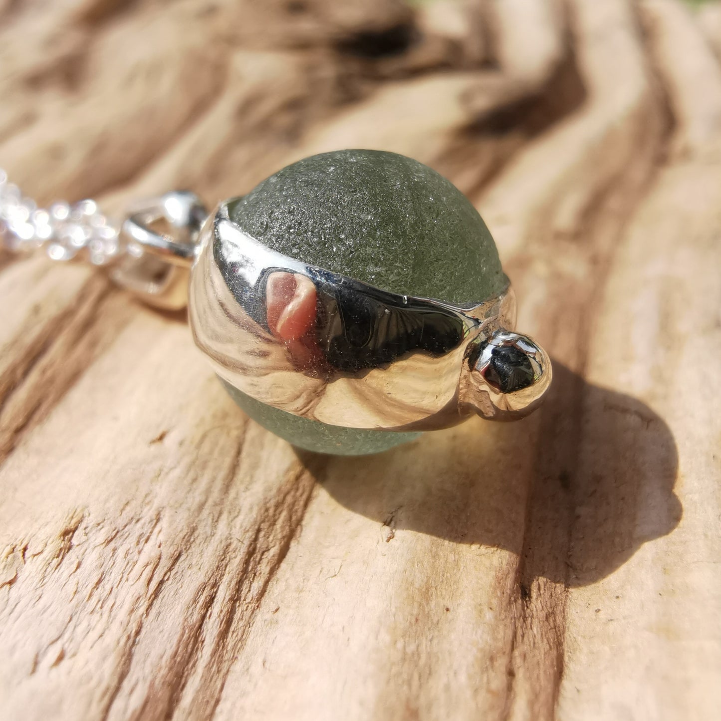 Genuine tiny Scottish Codd sea glass marble & sterling silver pendant.