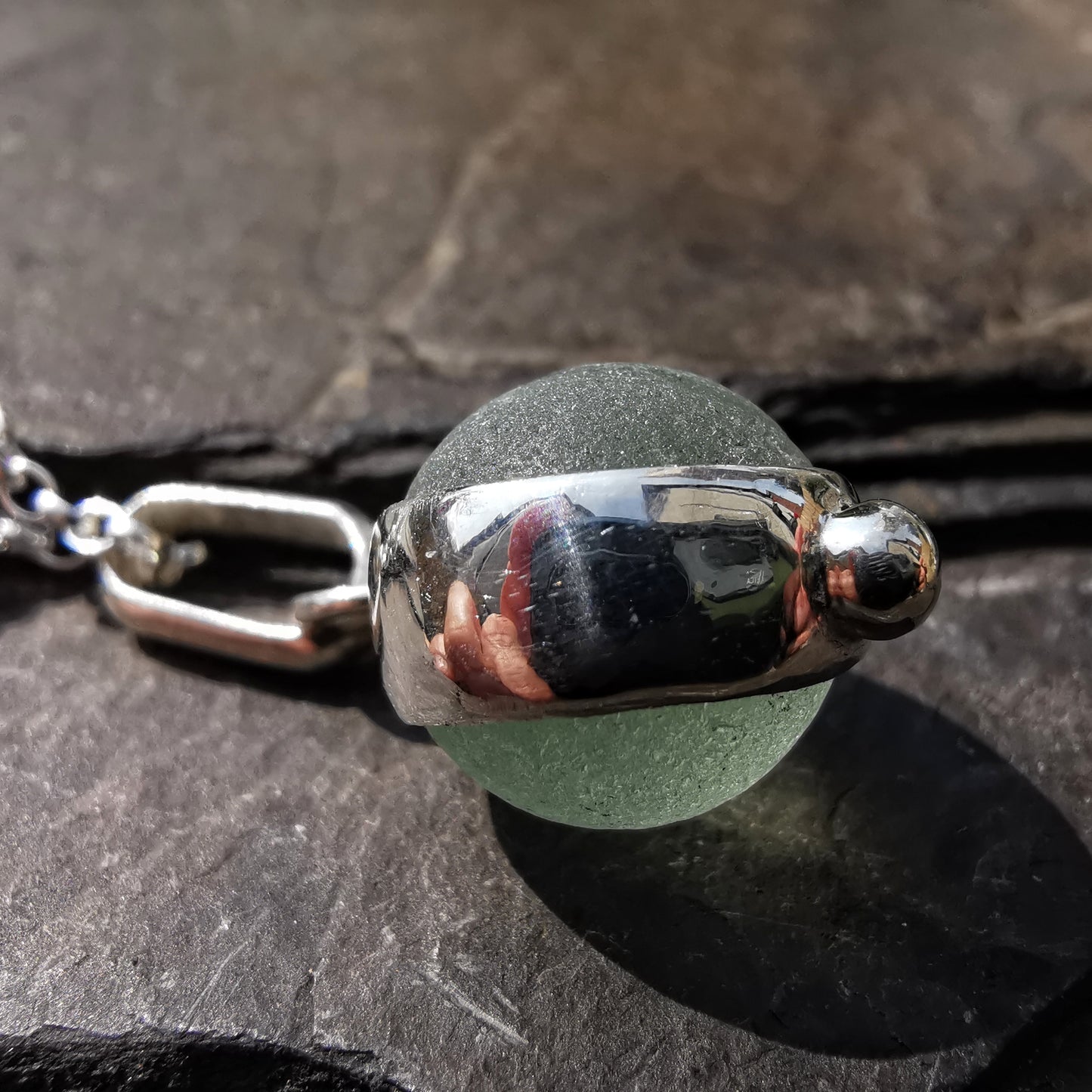 Genuine tiny Scottish Codd sea glass marble & sterling silver pendant.