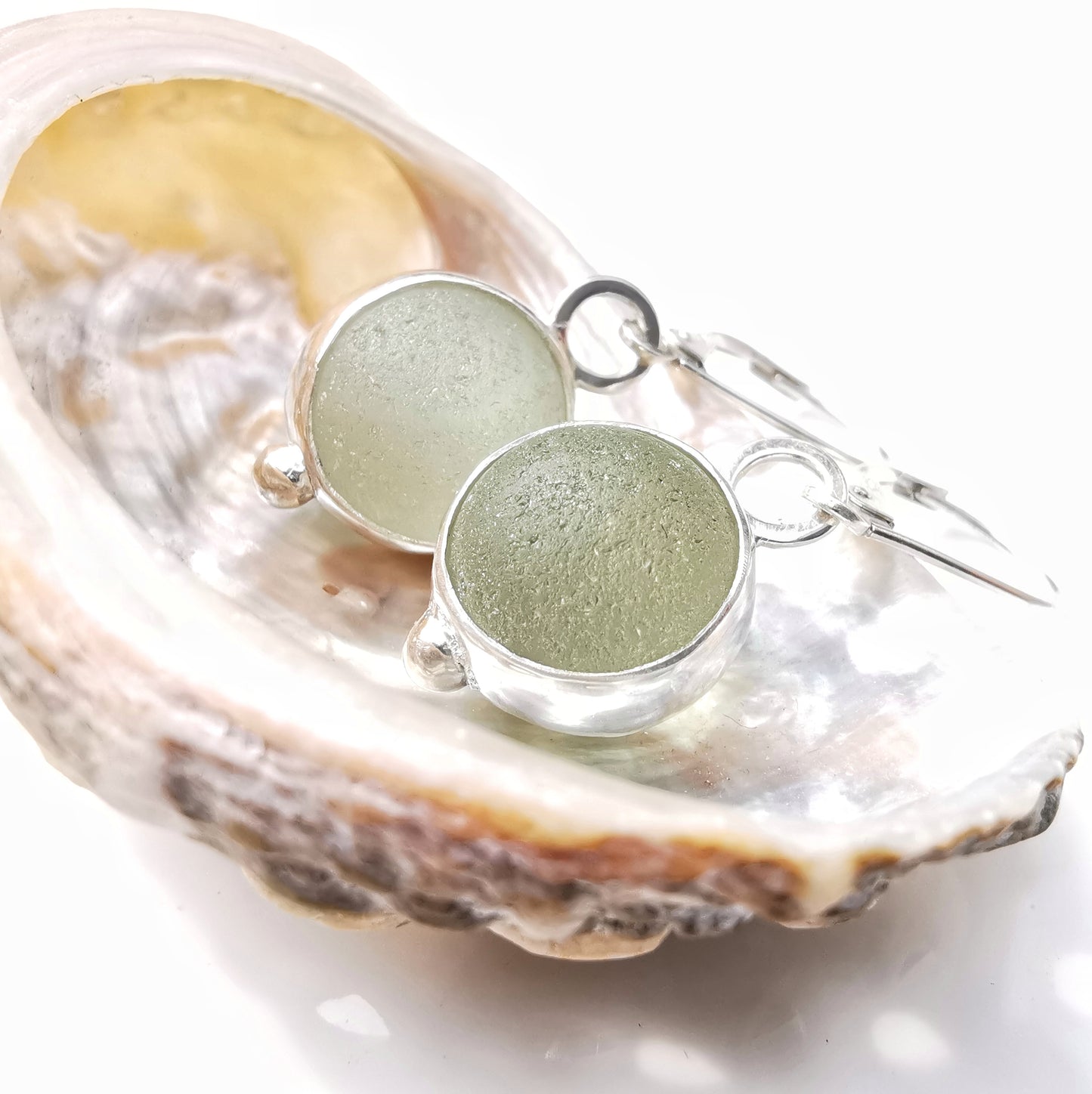 Genuine Scottish green sea glass marbles and sterling silver earrings.