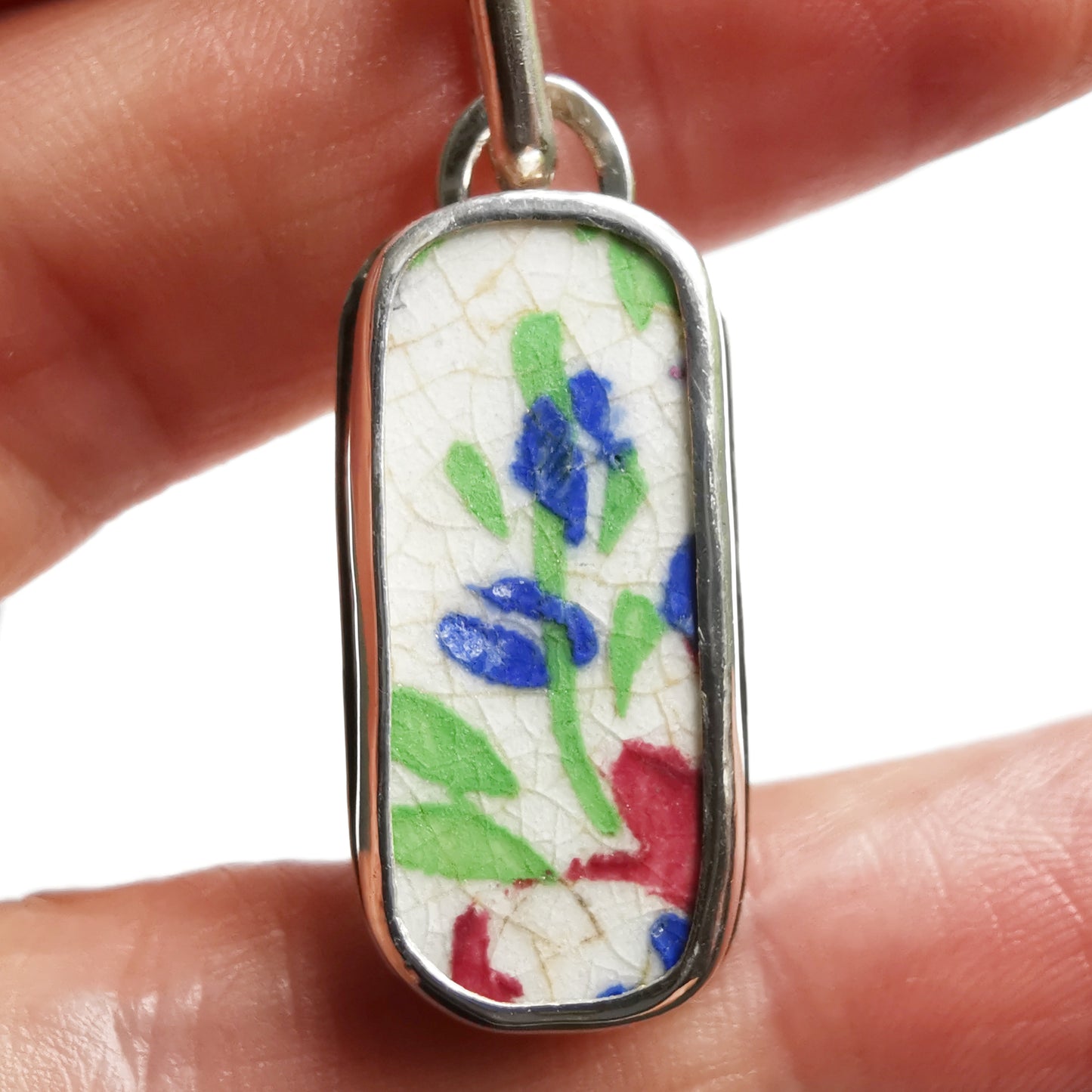 Scottish foliage pattern sea pottery & sterling silver pendant.