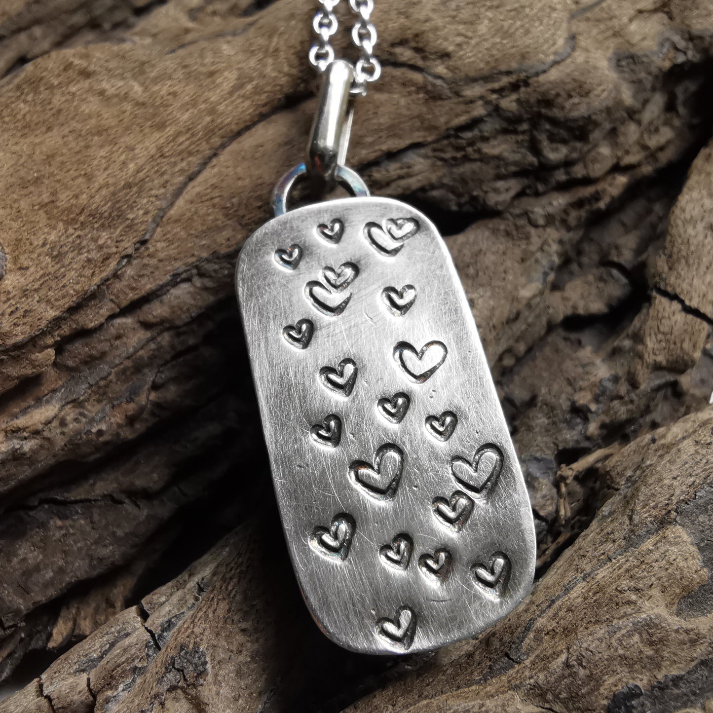 Scottish foliage pattern sea pottery & sterling silver pendant.