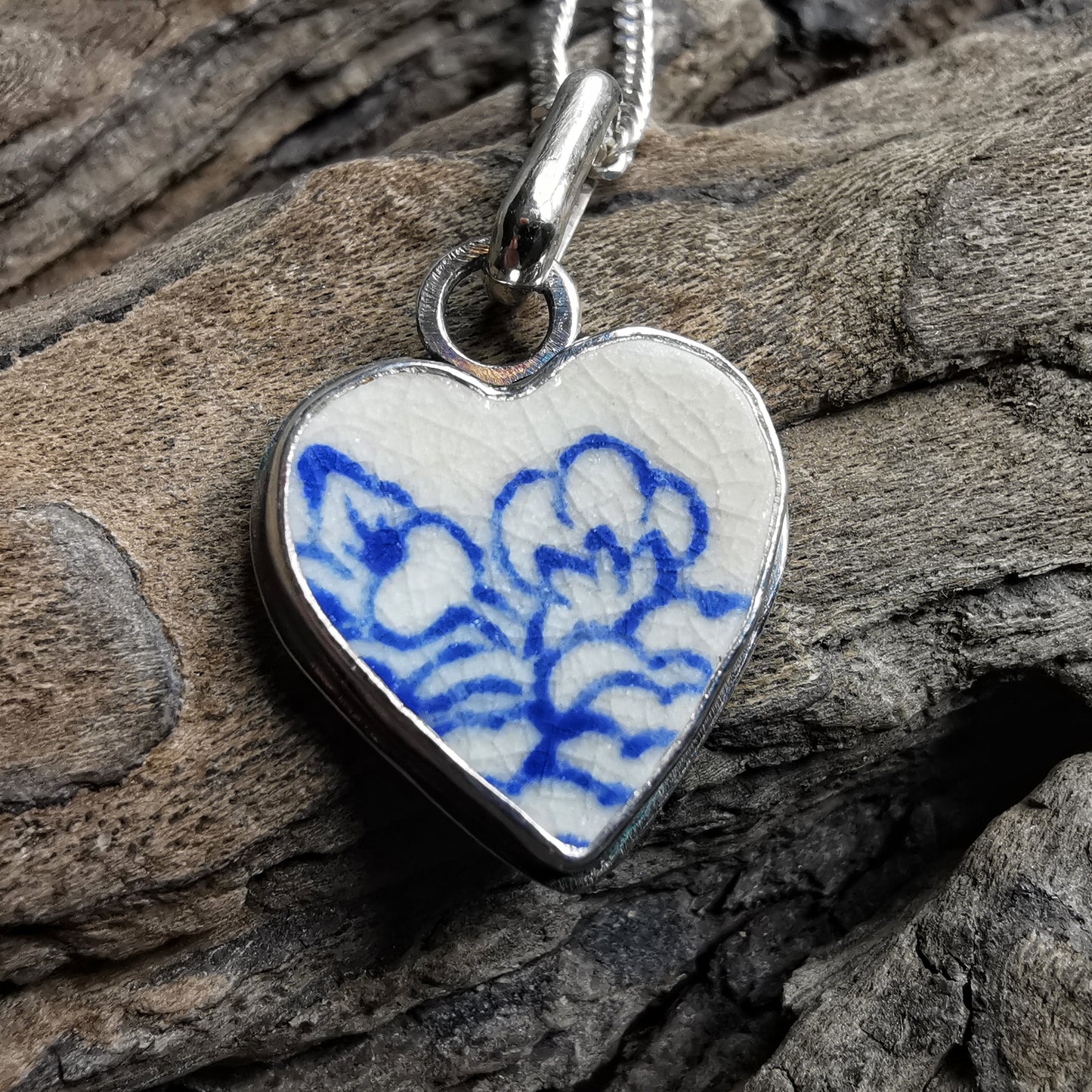 Blue and white sea pottery heart & sterling silver pendant.