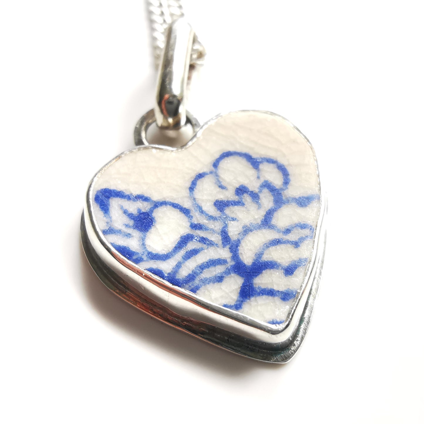 Blue and white sea pottery heart & sterling silver pendant.