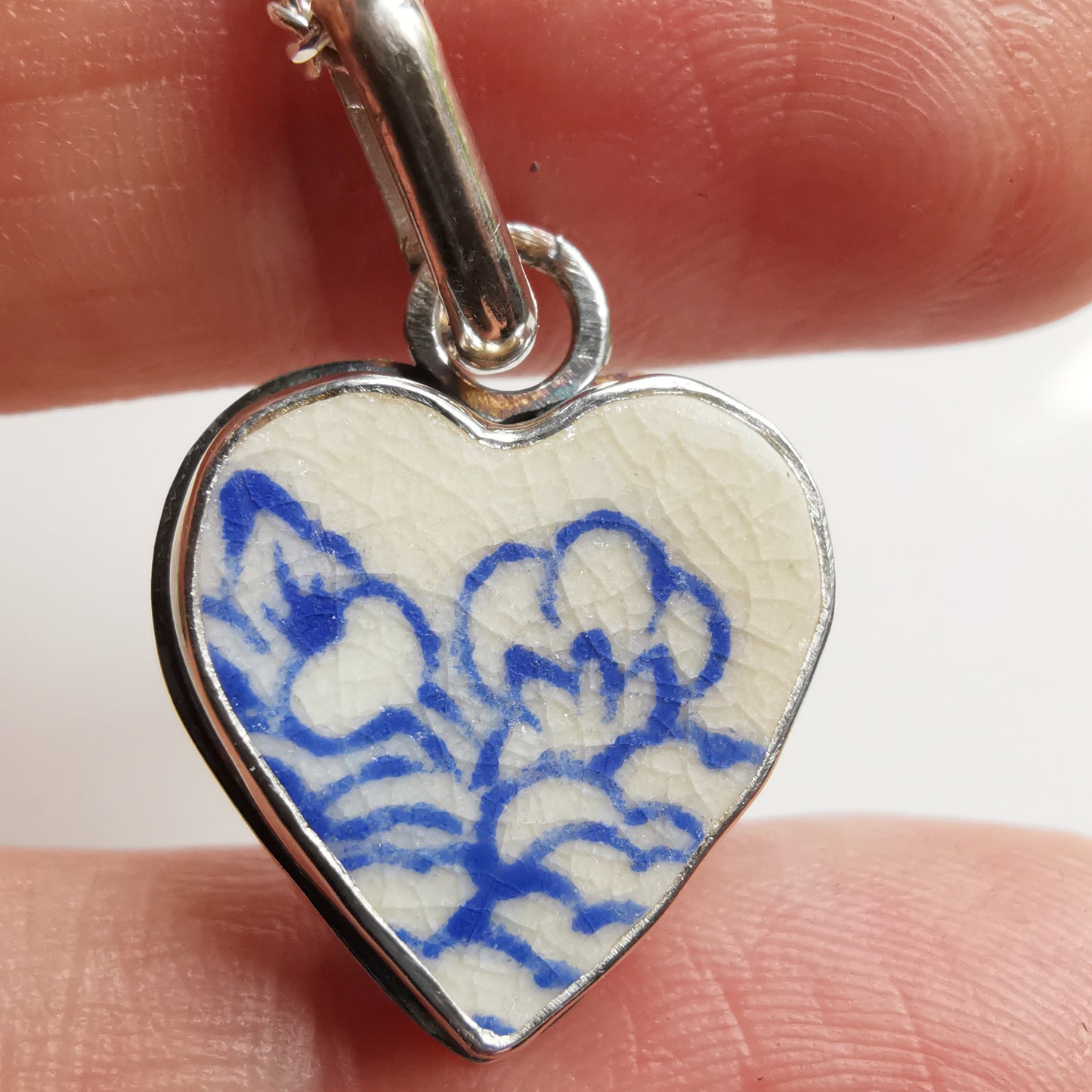 Blue and white sea pottery heart & sterling silver pendant.