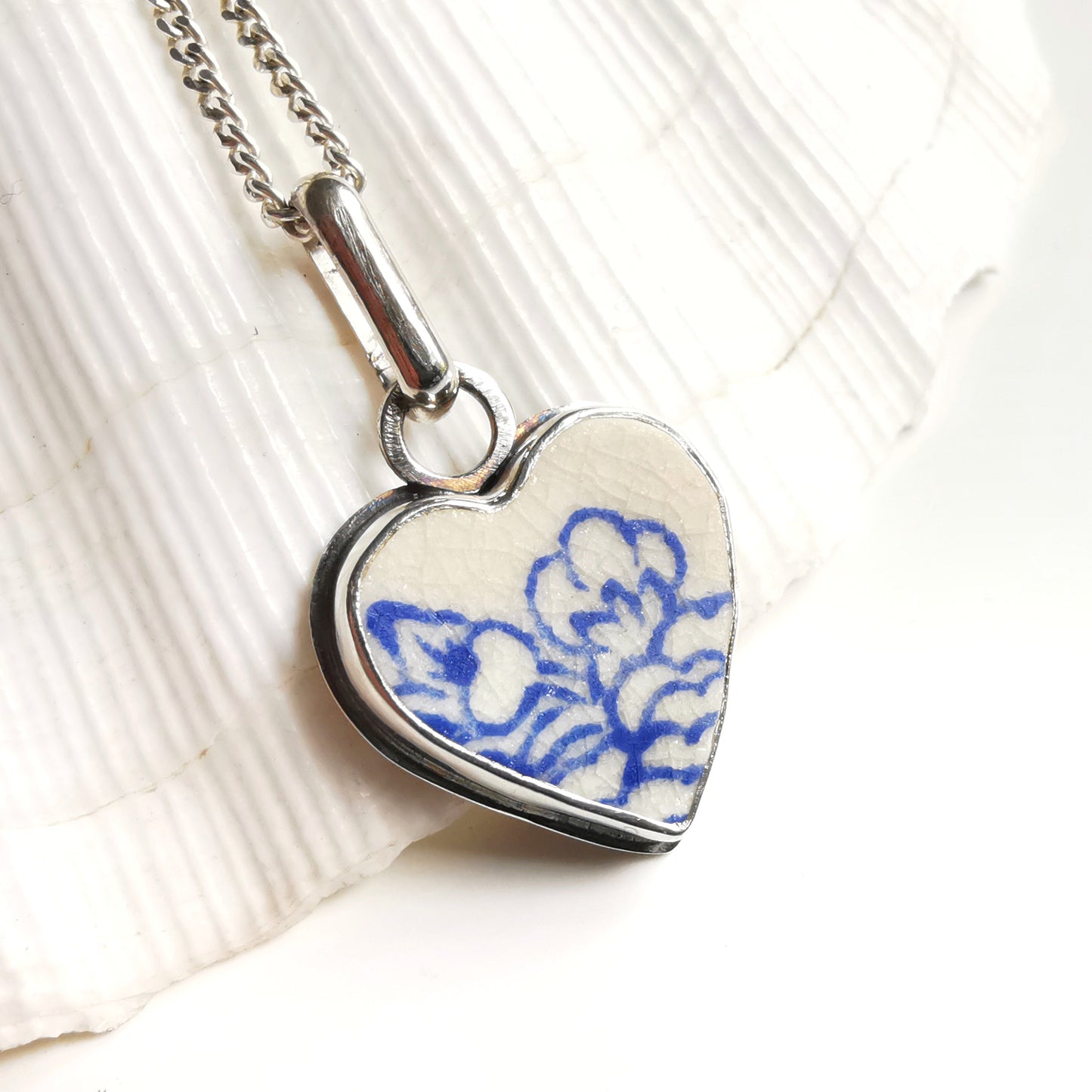 Blue and white sea pottery heart & sterling silver pendant.