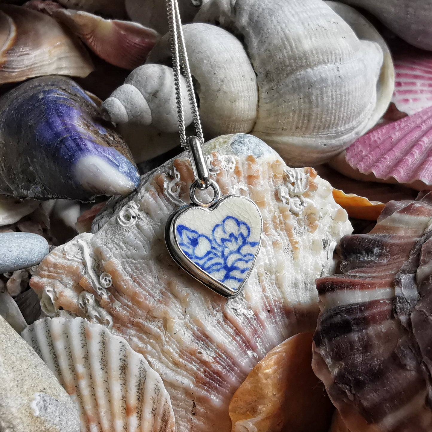 Blue and white sea pottery heart & sterling silver pendant.