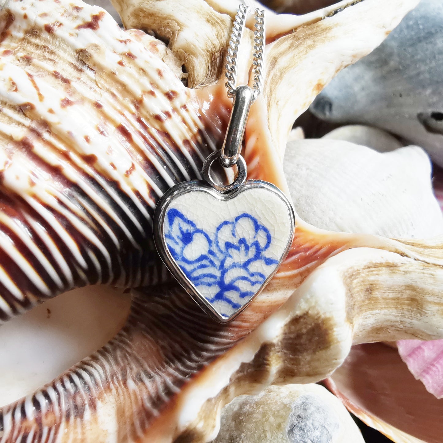 Blue and white sea pottery heart & sterling silver pendant.