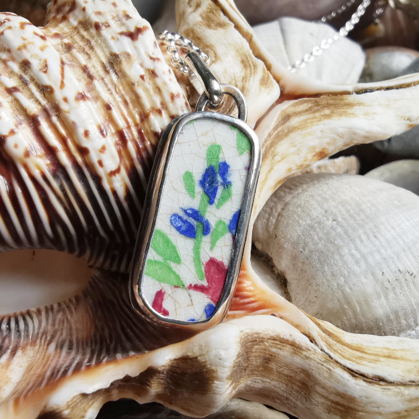 Scottish foliage pattern sea pottery & sterling silver pendant.
