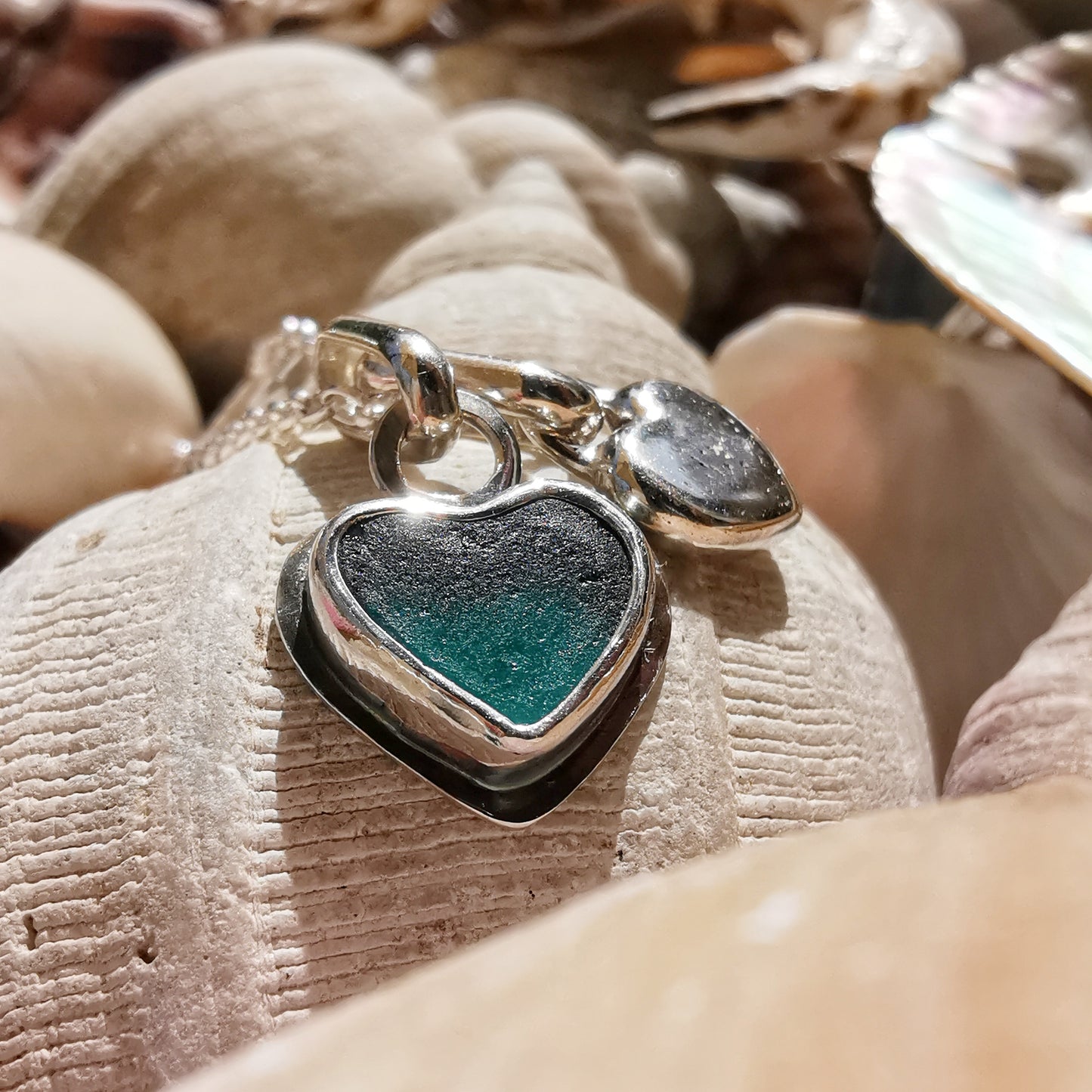 Scottish teal sea glass & sterling silver heart pendants.