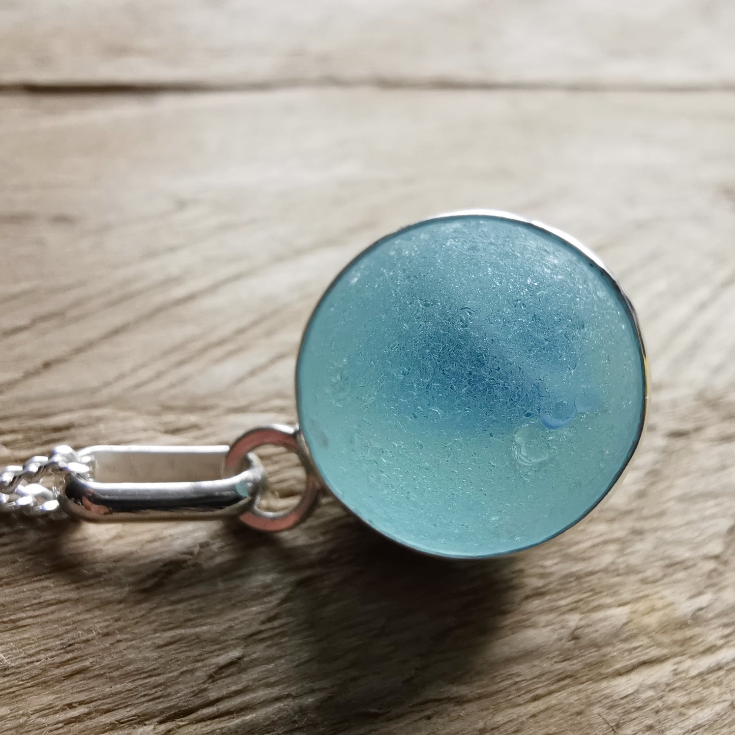 Aqua blue sea glass marble & sterling silver pendant.