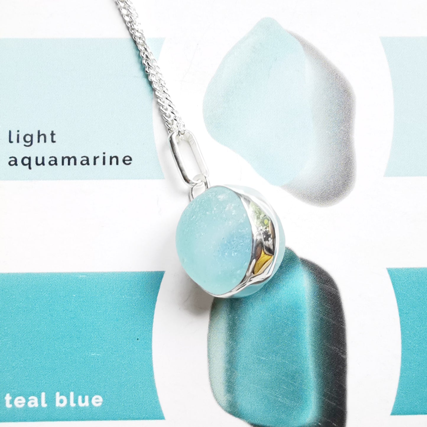 Aqua blue sea glass marble & sterling silver pendant.
