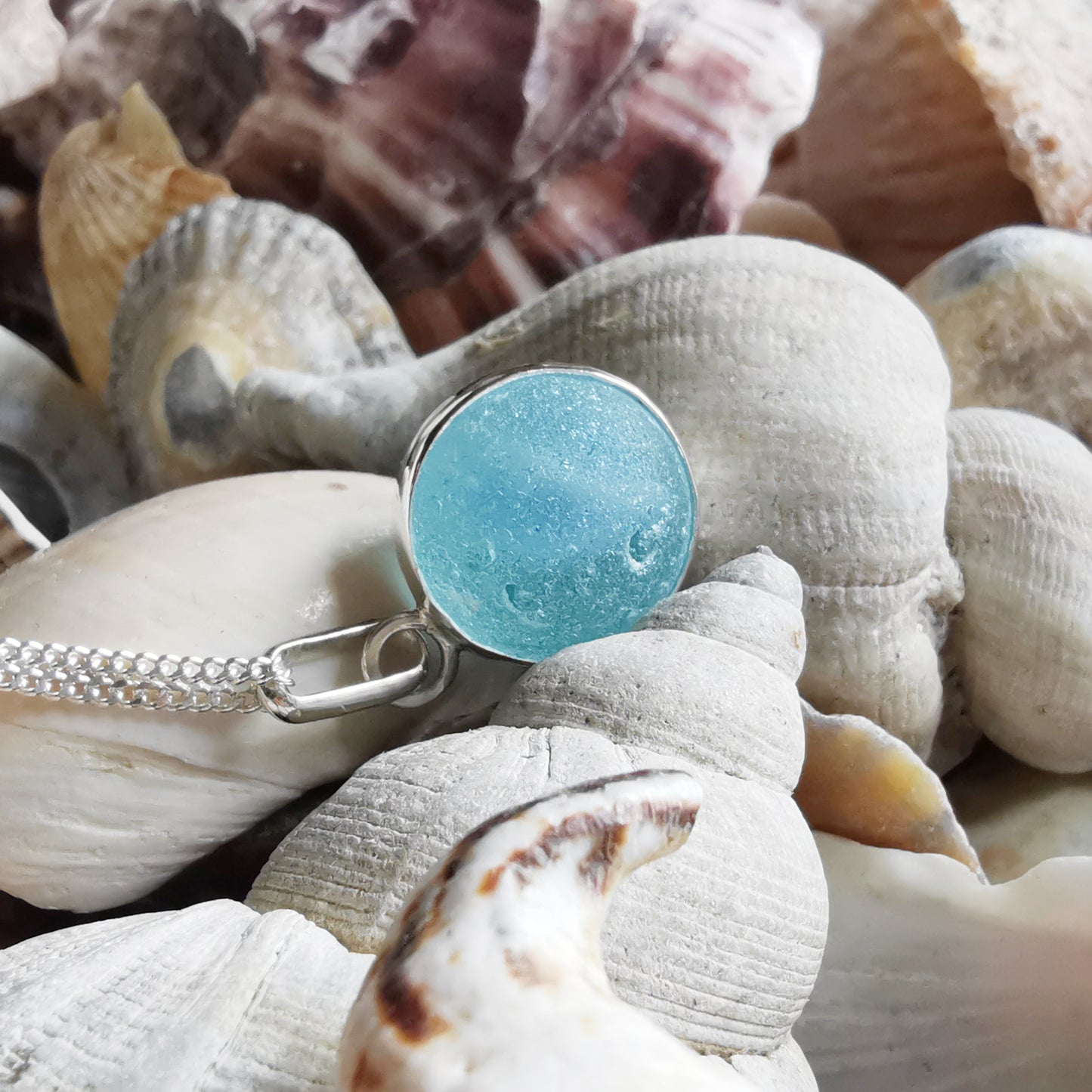 Aqua blue sea glass marble & sterling silver pendant.