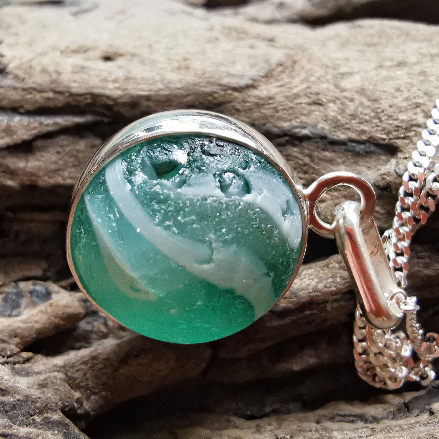 Scottish teal green sea glass marble & sterling silver pendant.
