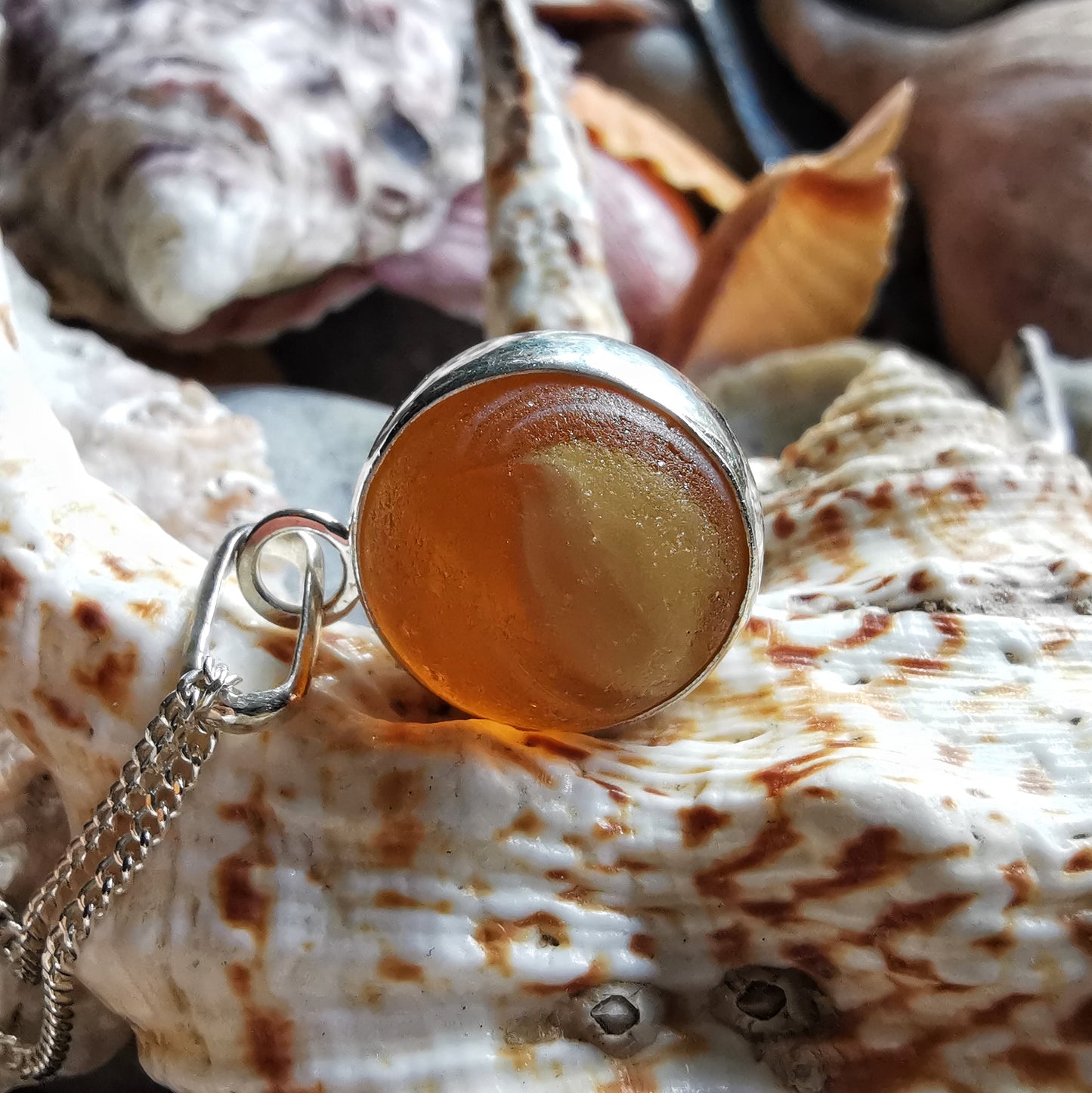 Genuine Scottish brown sea glass marble & sterling silver pendant.