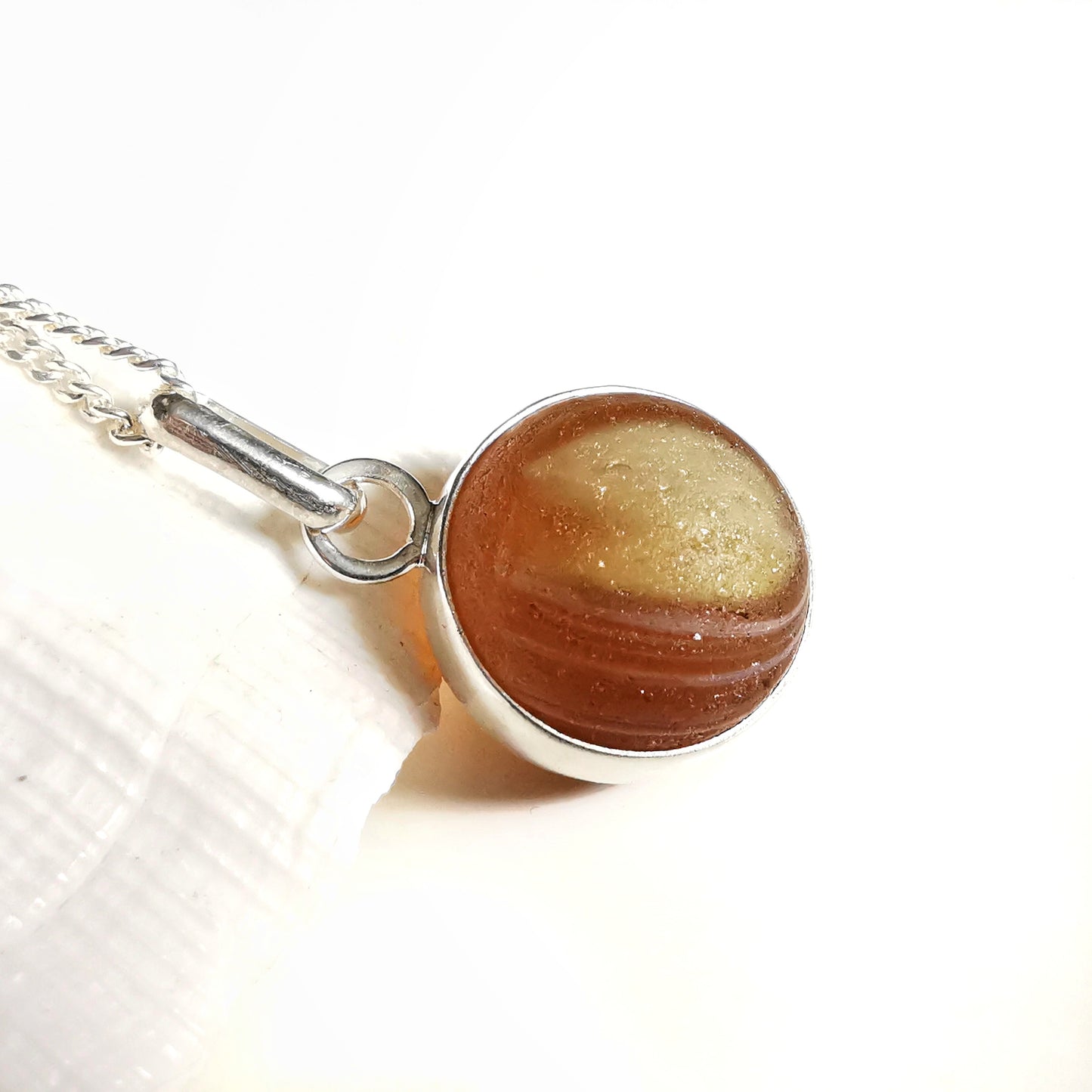 Genuine Scottish brown sea glass marble & sterling silver pendant.