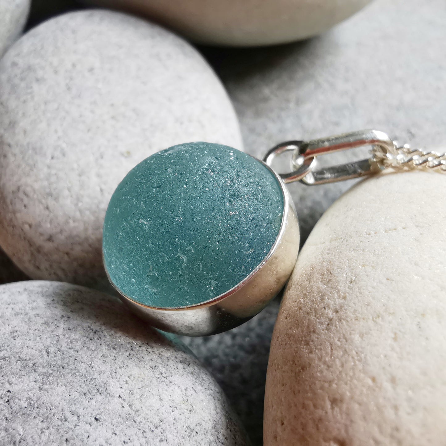 Light blue sea glass marble & sterling silver pendant.
