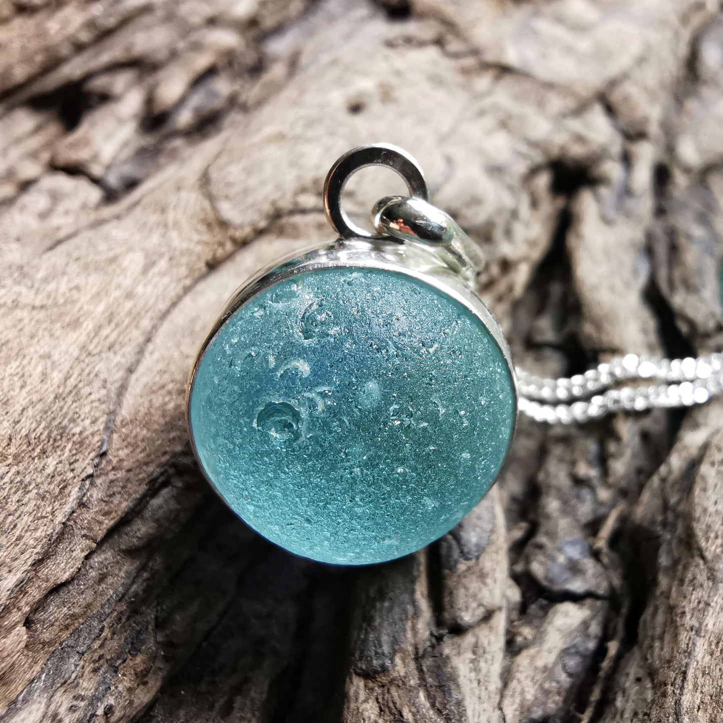 Light blue sea glass marble & sterling silver pendant.