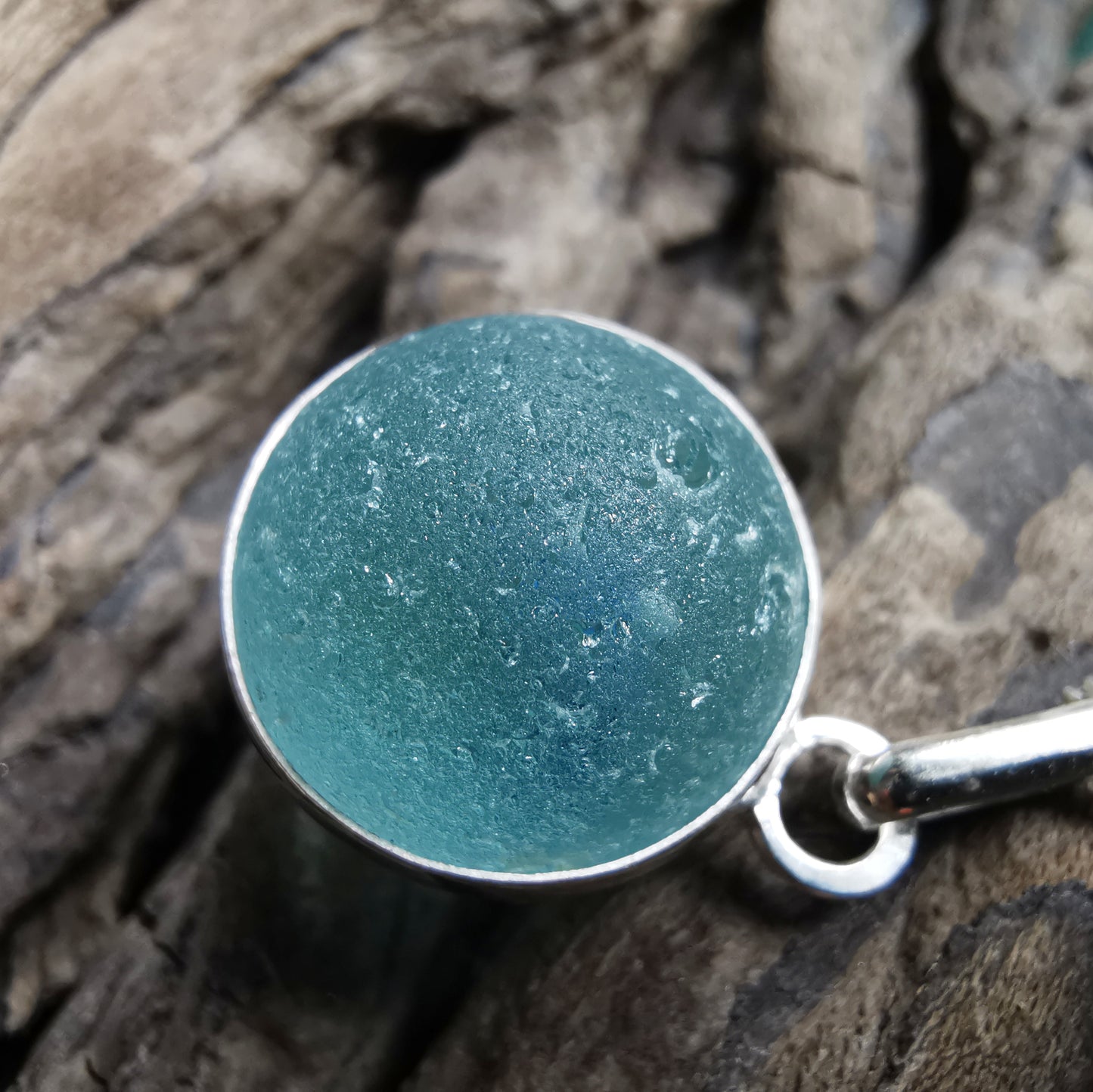 Light blue sea glass marble & sterling silver pendant.