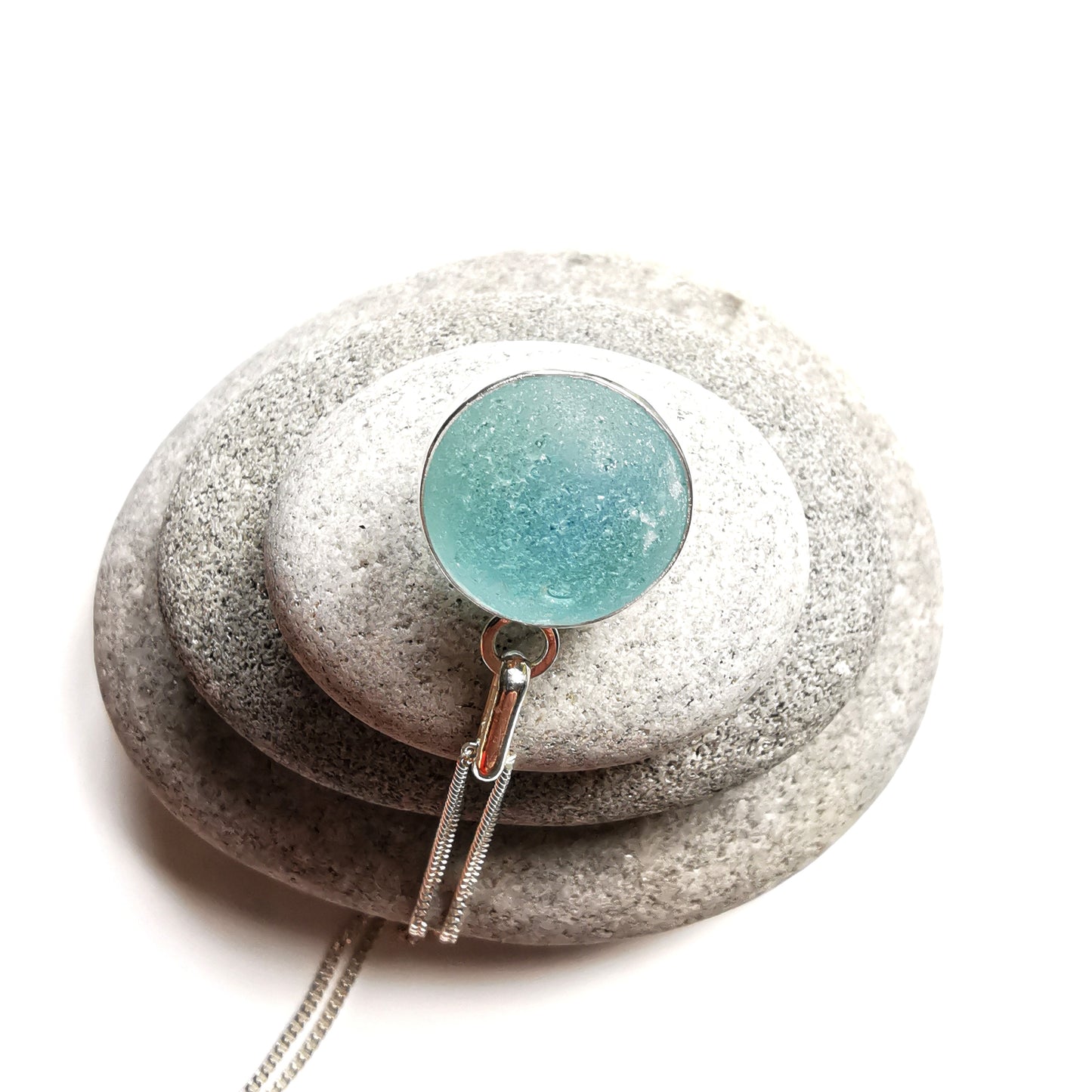 Light blue sea glass marble & sterling silver pendant.