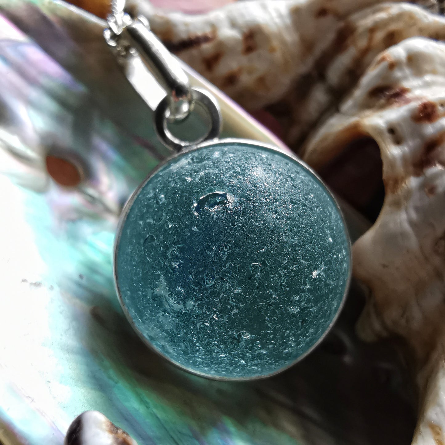 Light blue sea glass marble & sterling silver pendant.