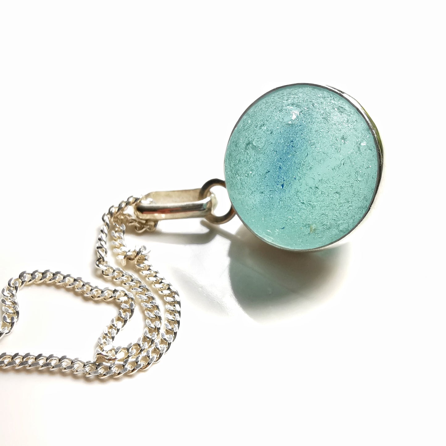 Light blue sea glass marble & sterling silver pendant.