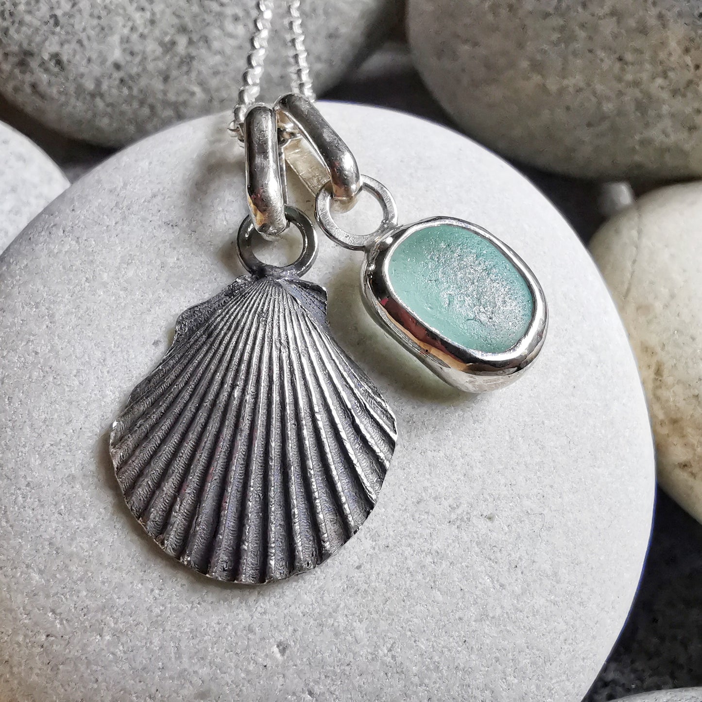 Seafoam sea glass and silver shell pendants duo.