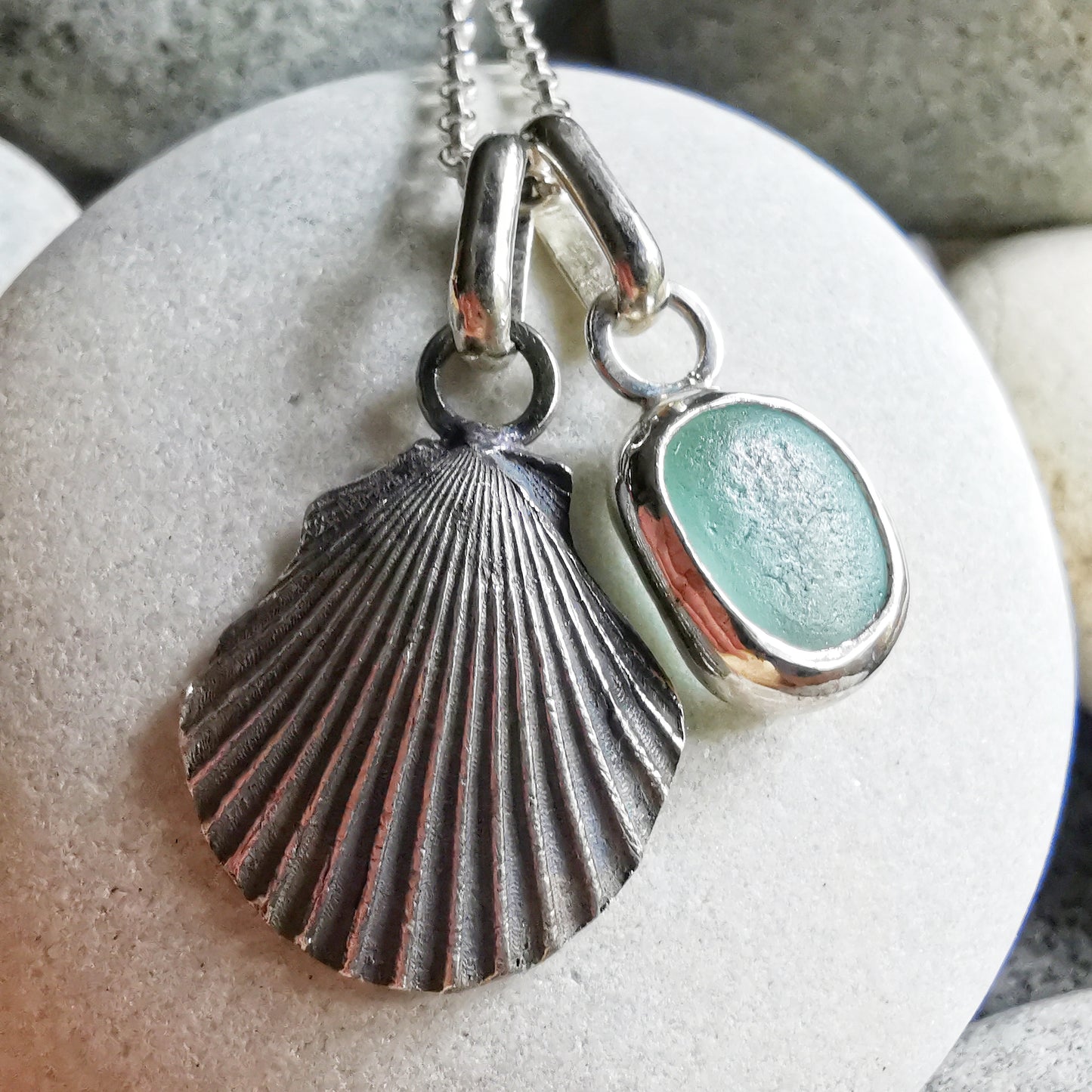 Seafoam sea glass and silver shell pendants duo.
