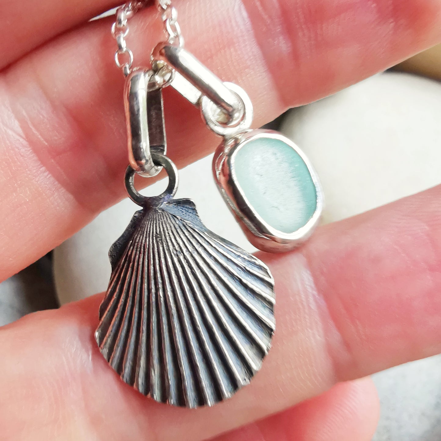Seafoam sea glass and silver shell pendants duo.