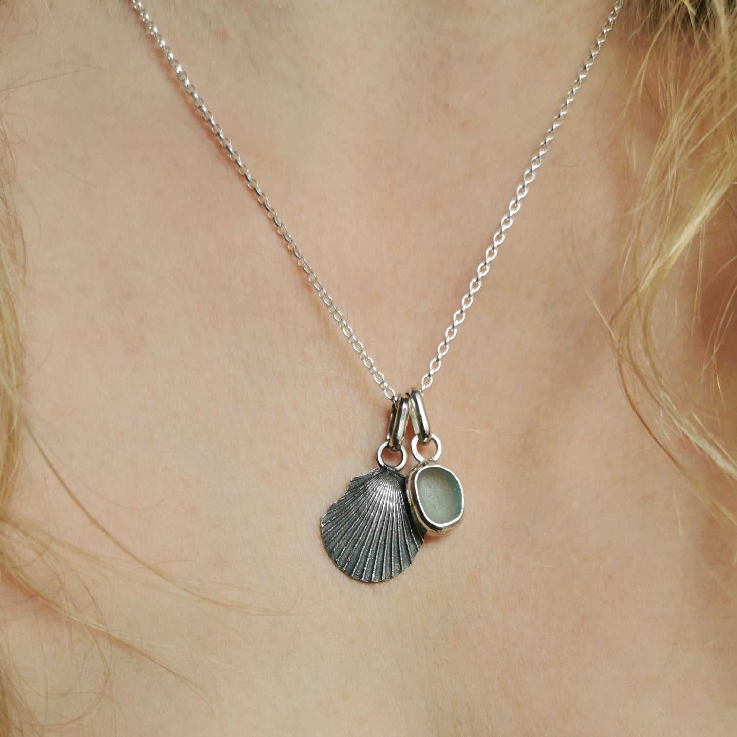Seafoam sea glass and silver shell pendants duo.