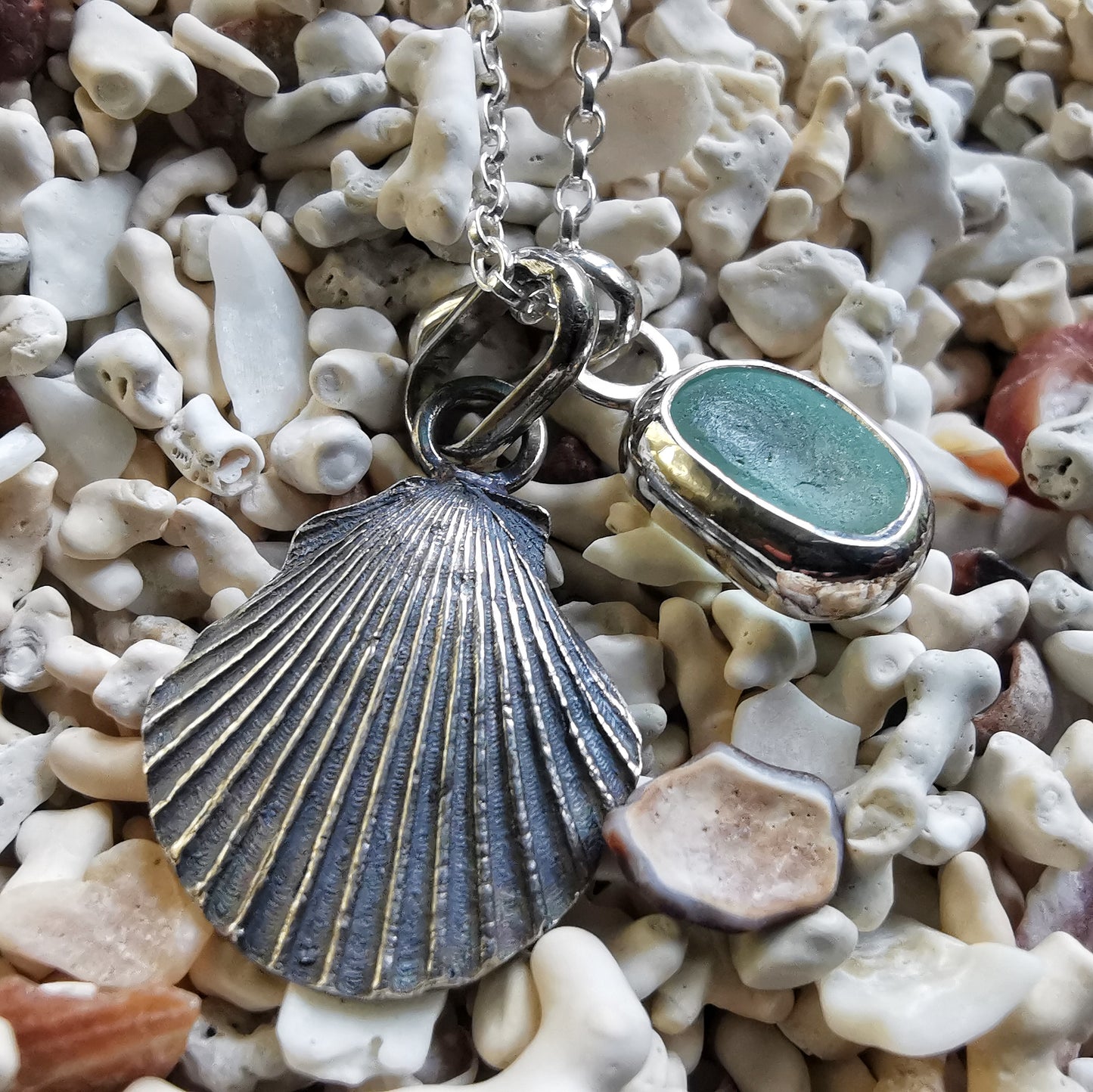 Seafoam sea glass and silver shell pendants duo.