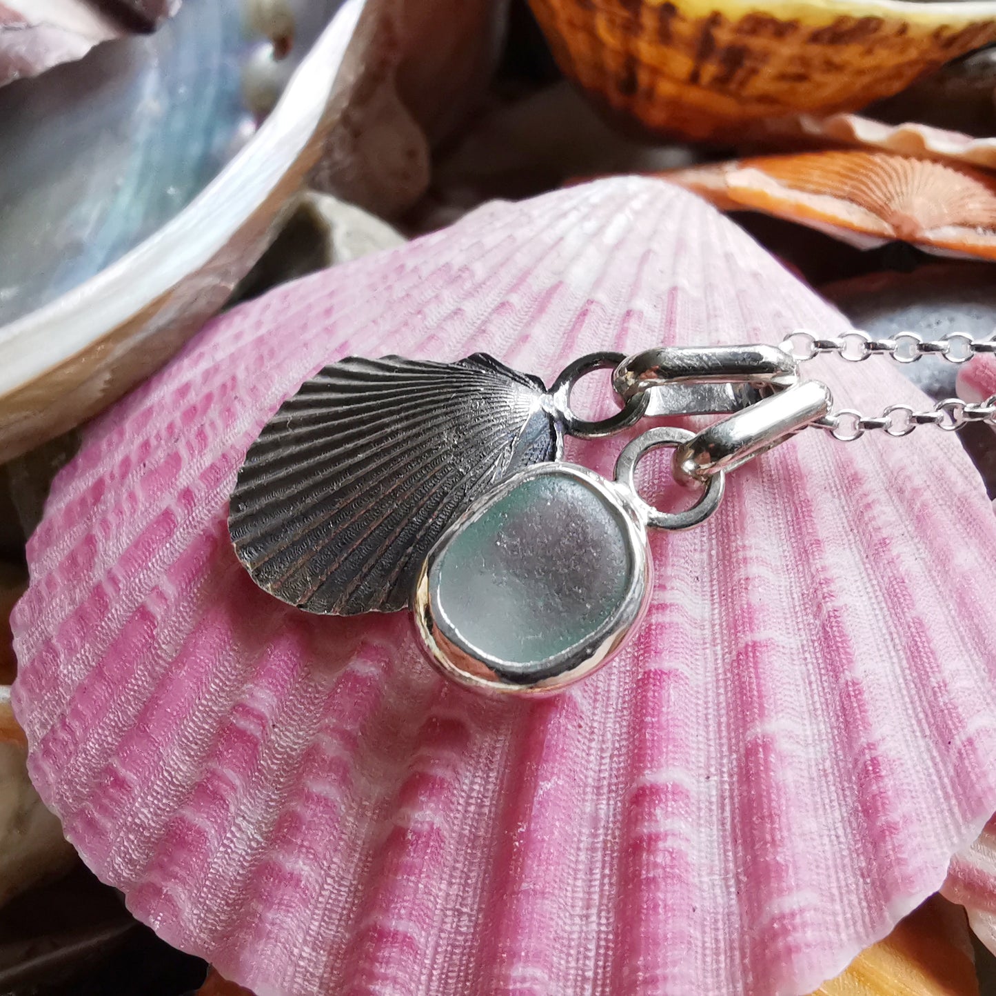 Seafoam sea glass and silver shell pendants duo.