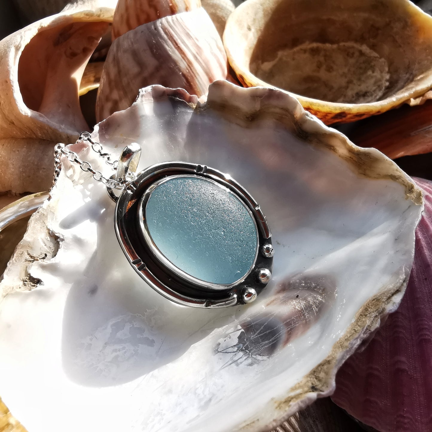 Scottish light blue sea glass & sterling silver pendant.