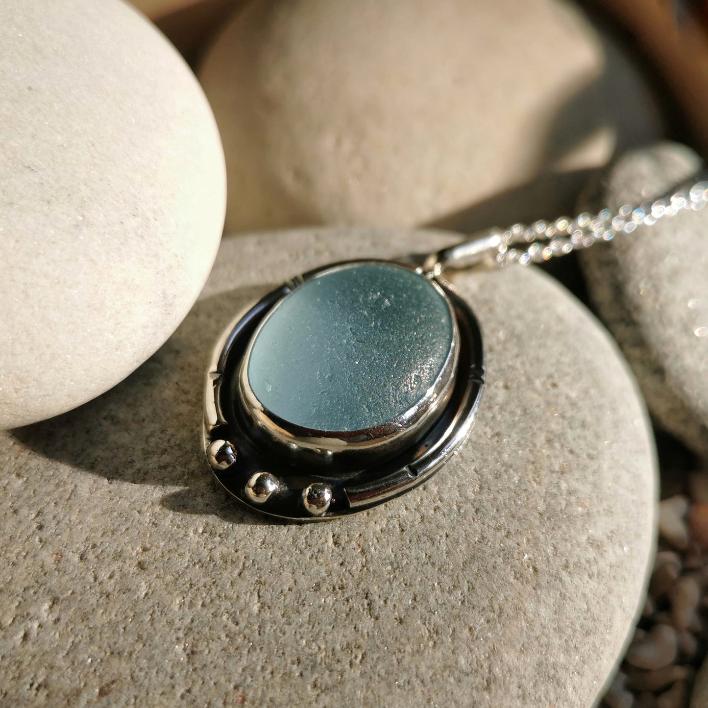 Scottish light blue sea glass & sterling silver pendant.