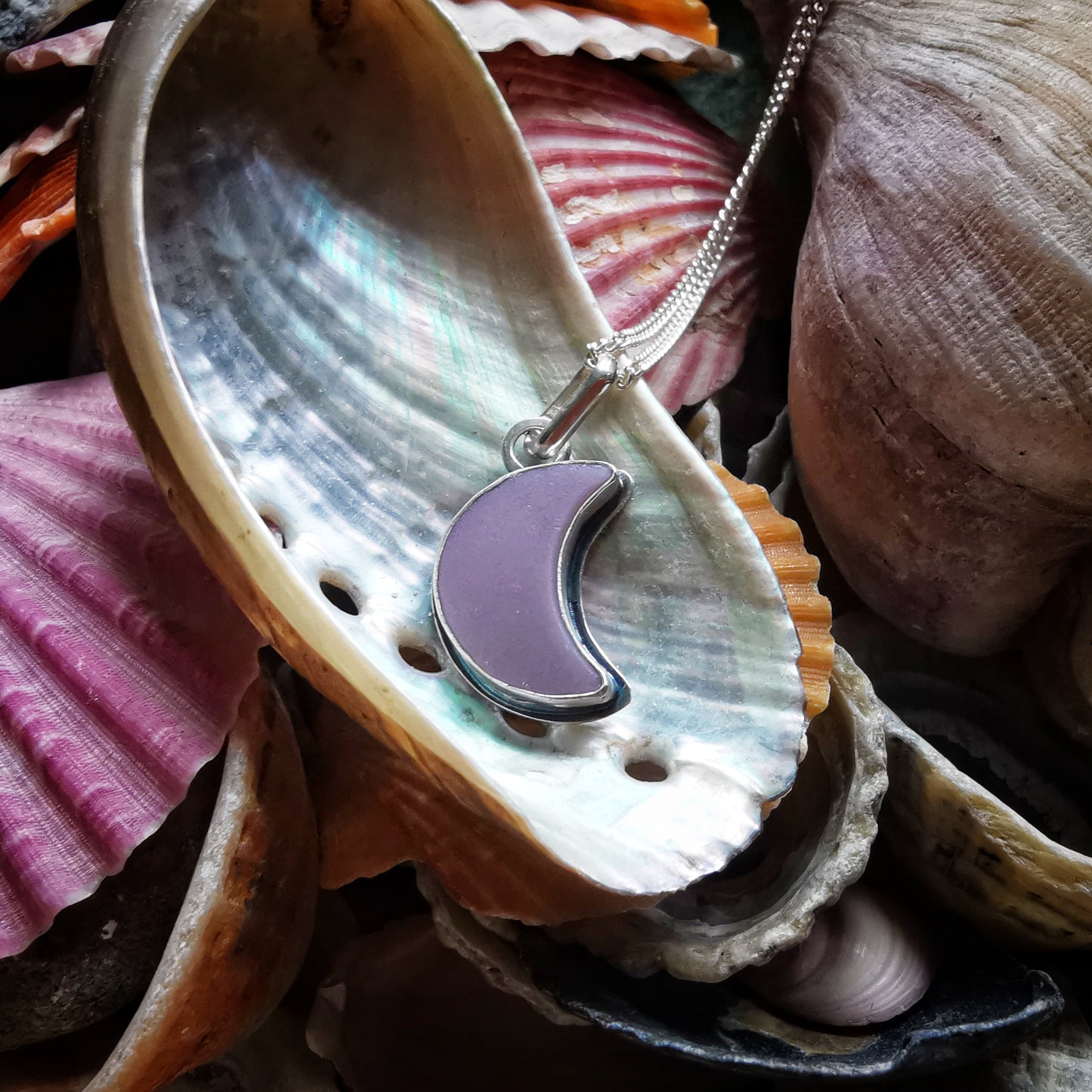 Purple crescent moon sea glass & sterling silver pendant.